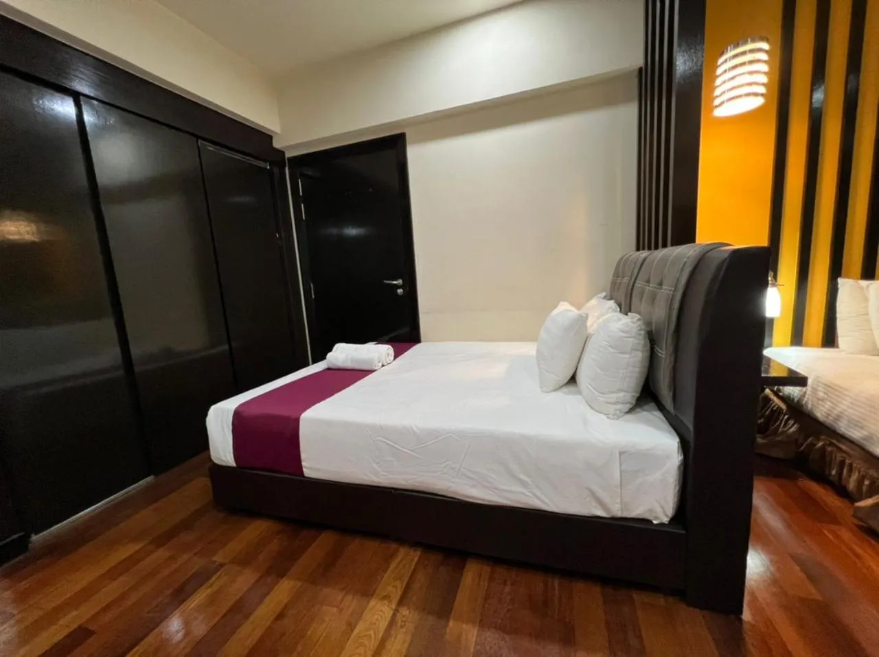 Bed in Raintree Resort Suites
