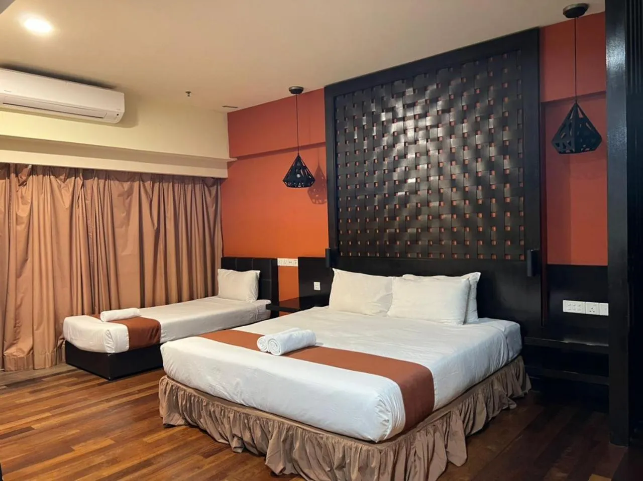 Bed in Raintree Resort Suites