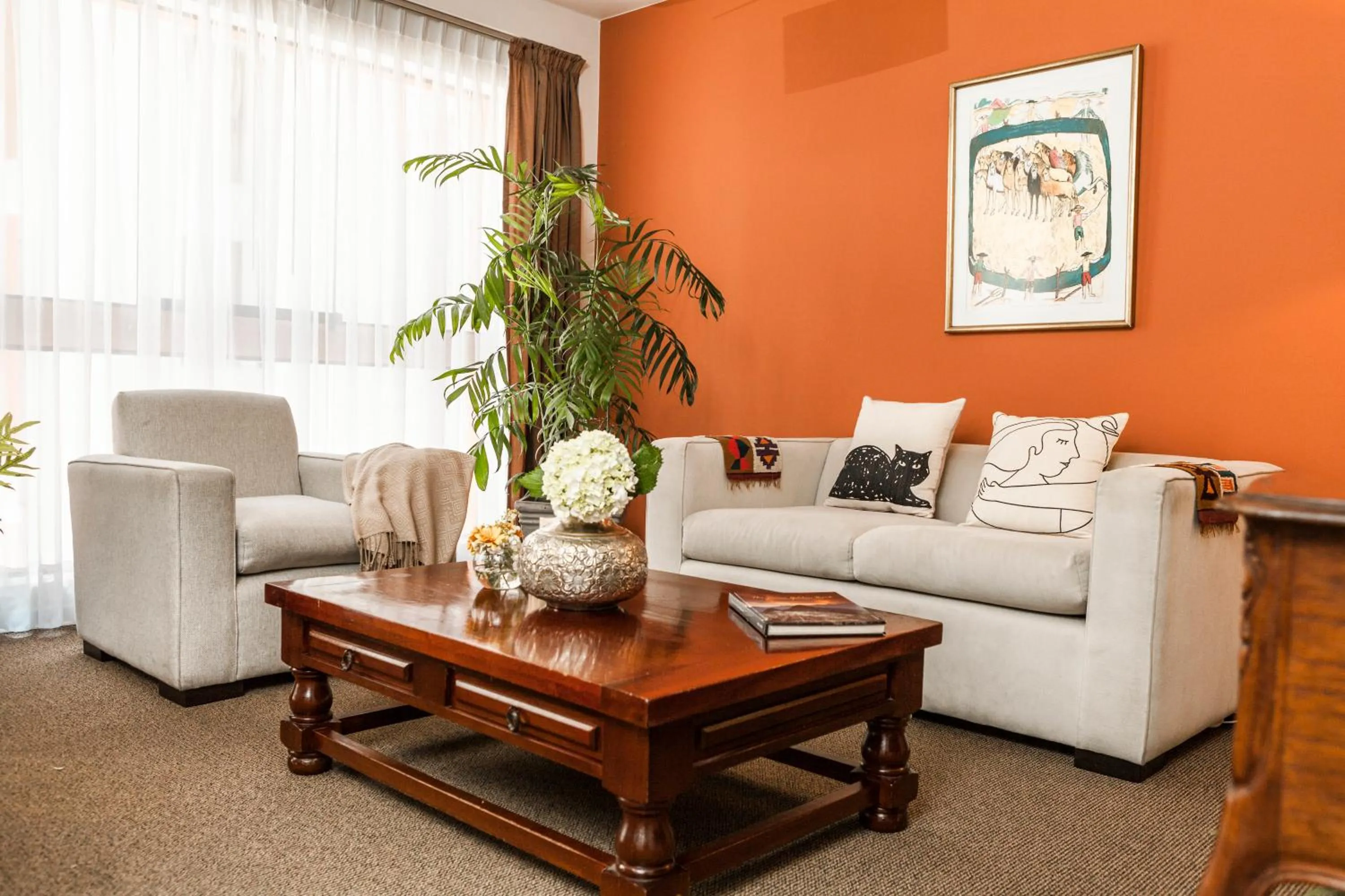 Living room in La Paz Apart Hotel