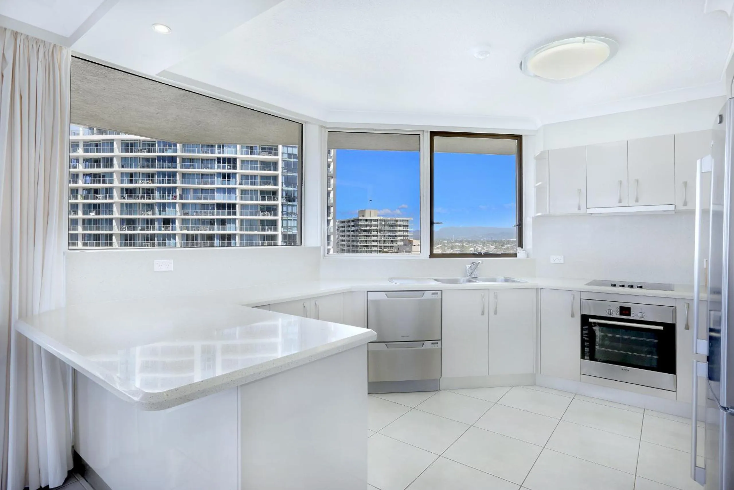 Kitchen or kitchenette in Genesis Apartments by Gold Coast Premium