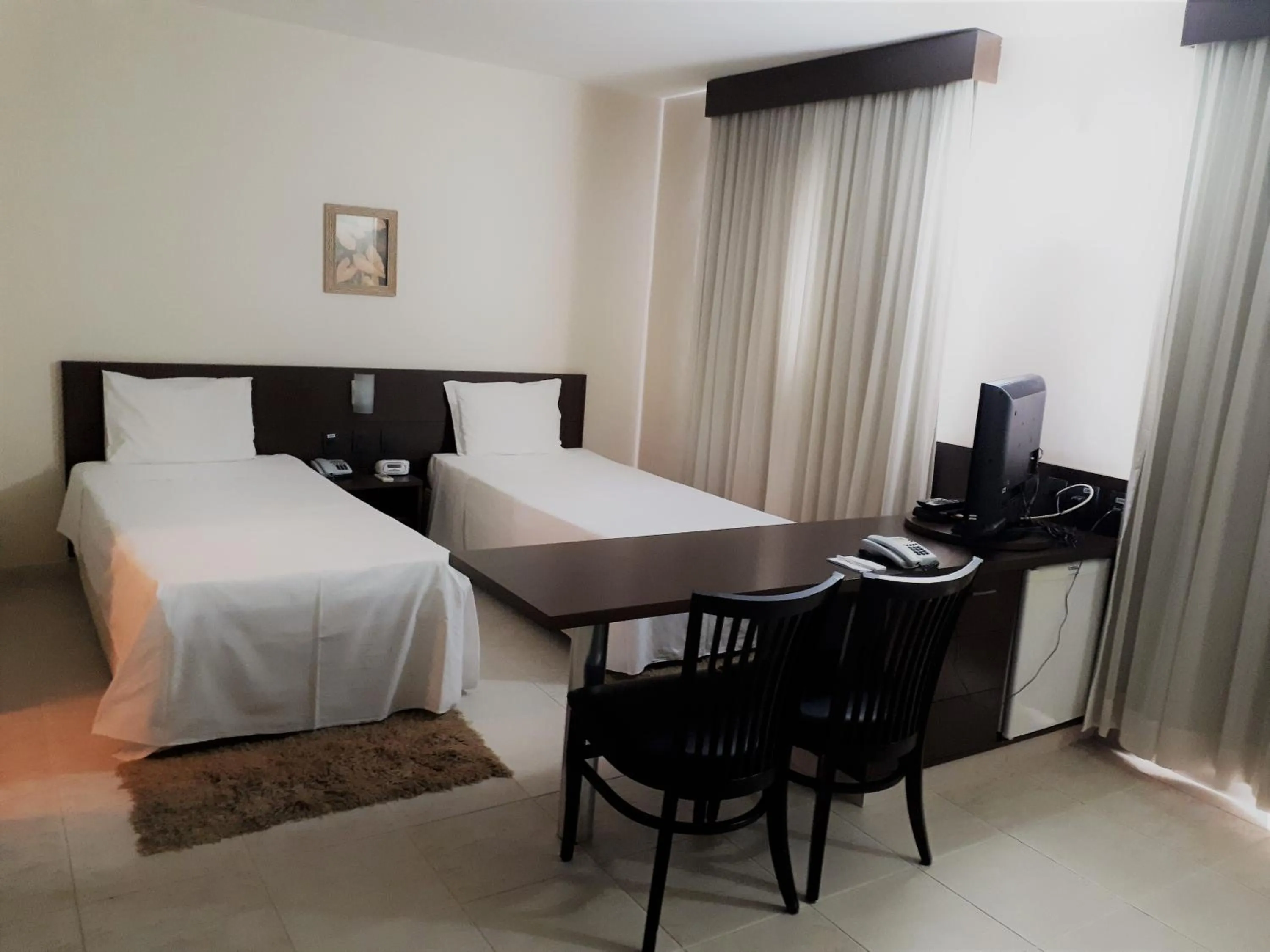 Bed in Hotel Santos Dumont