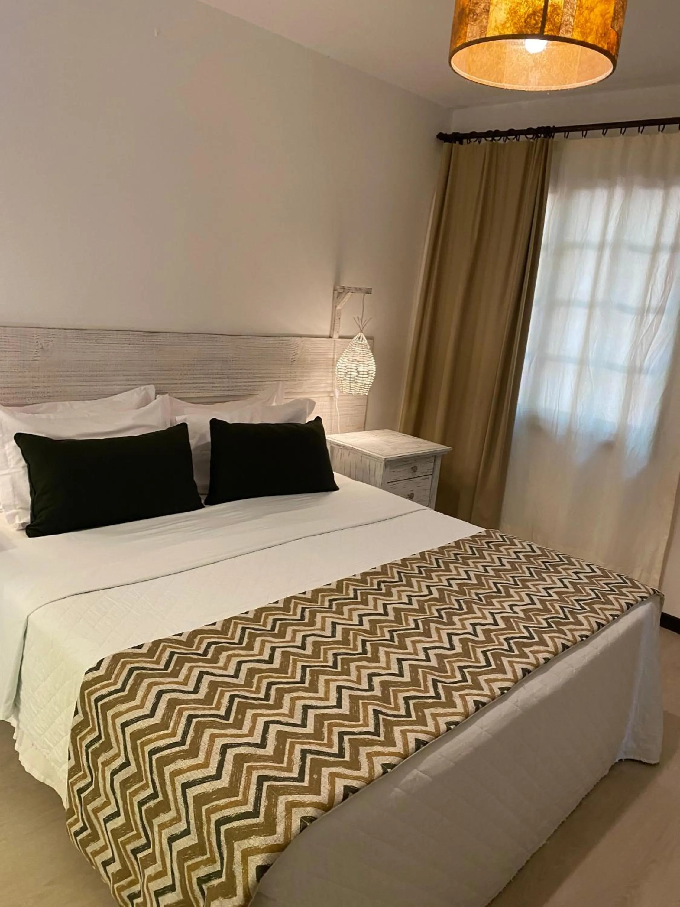 Bed in Girassóis Suítes