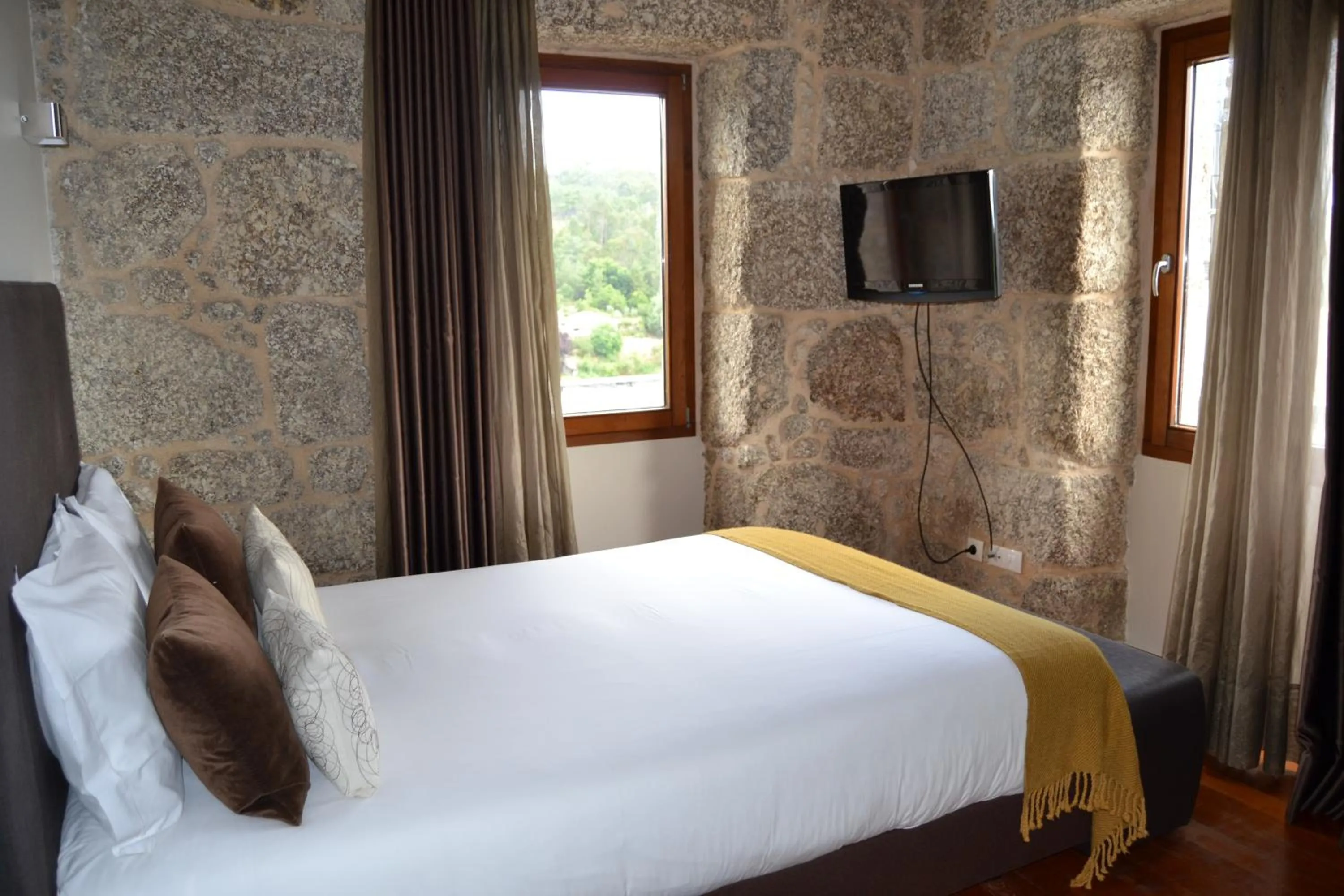 Bed in Quinta do Medronheiro Hotel Rural