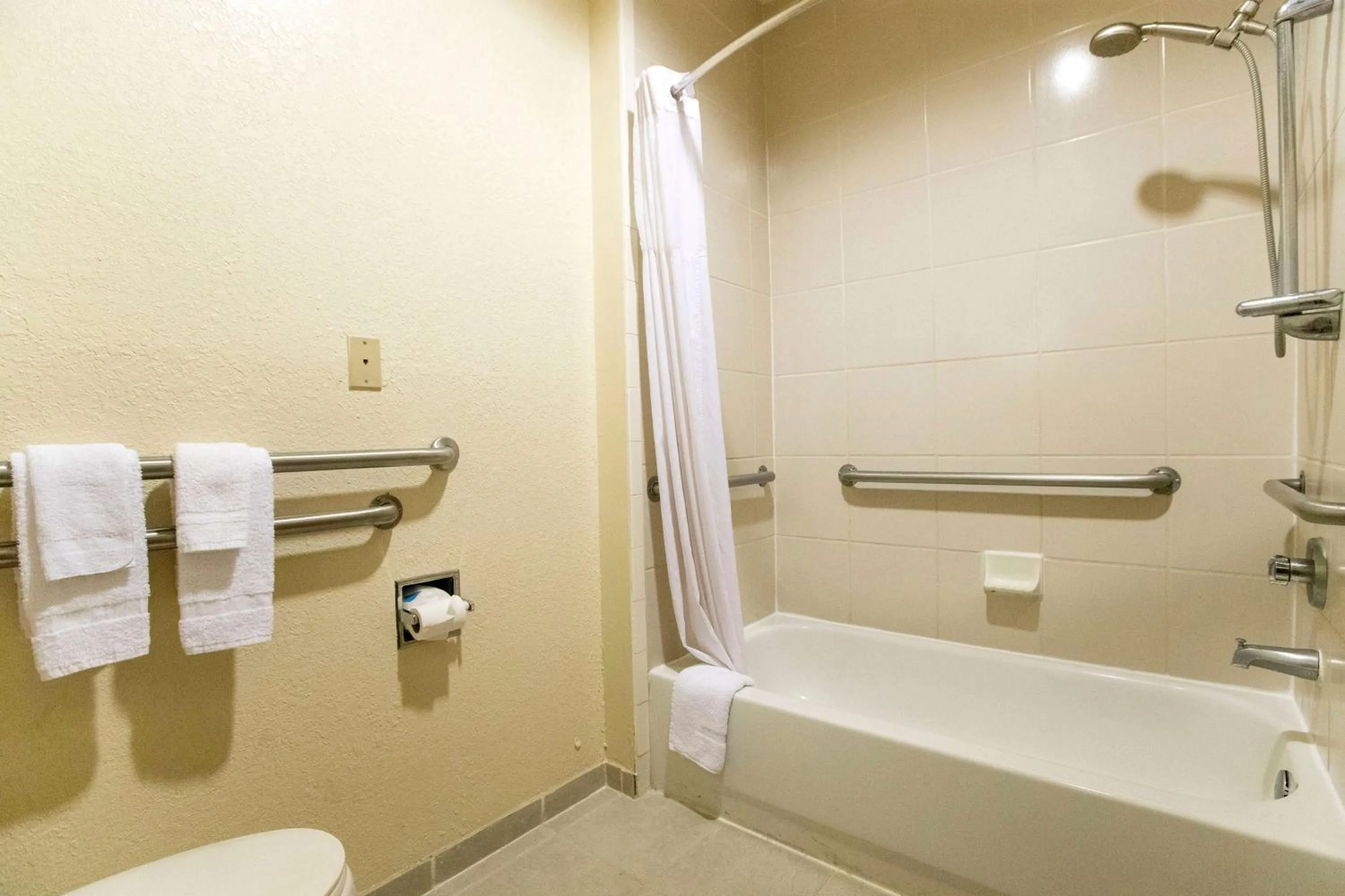 Bathroom in Days Inn & Suites by Wyndham Houston North/Aldine