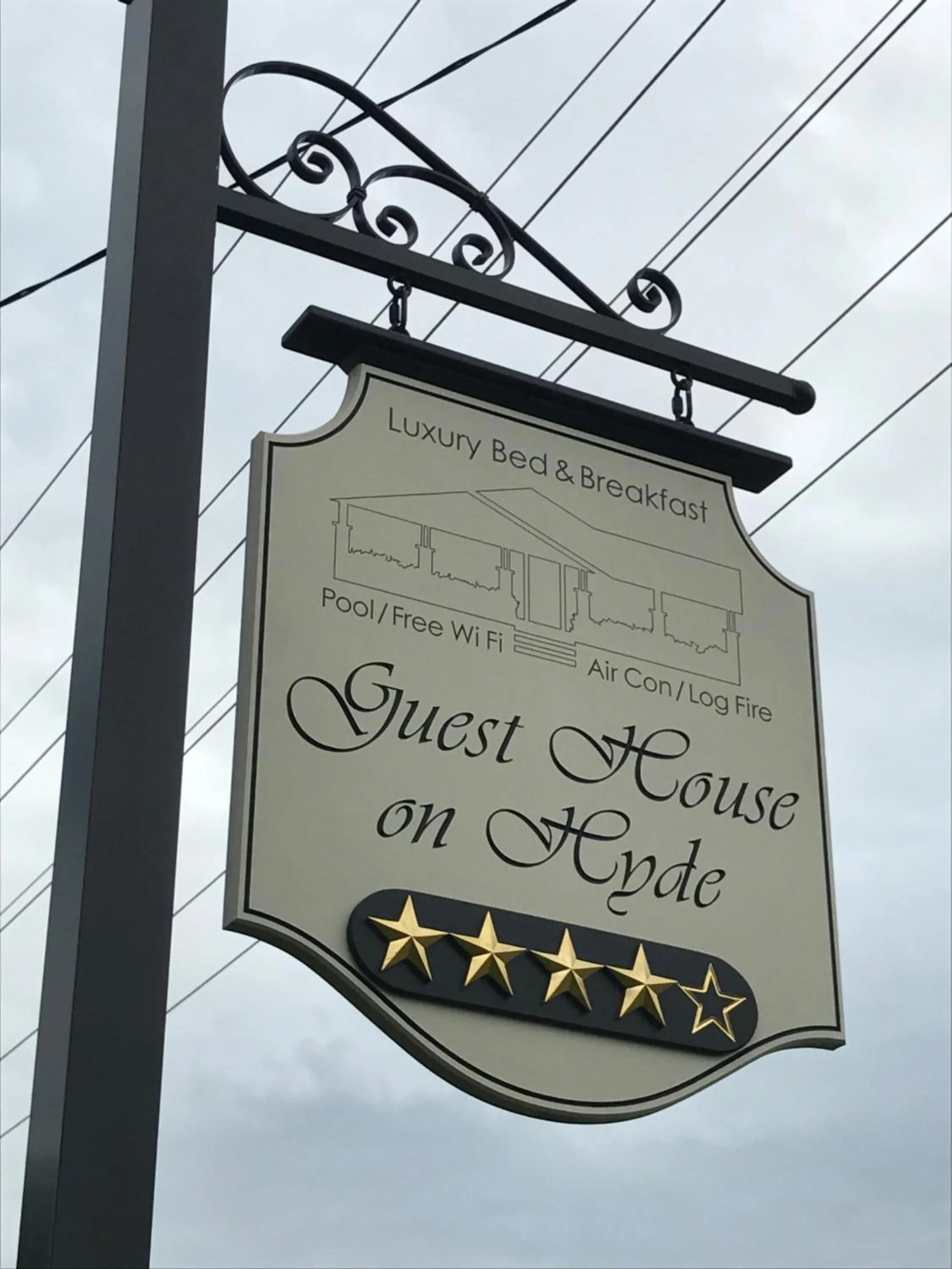 Property logo or sign in Guest House on Hyde