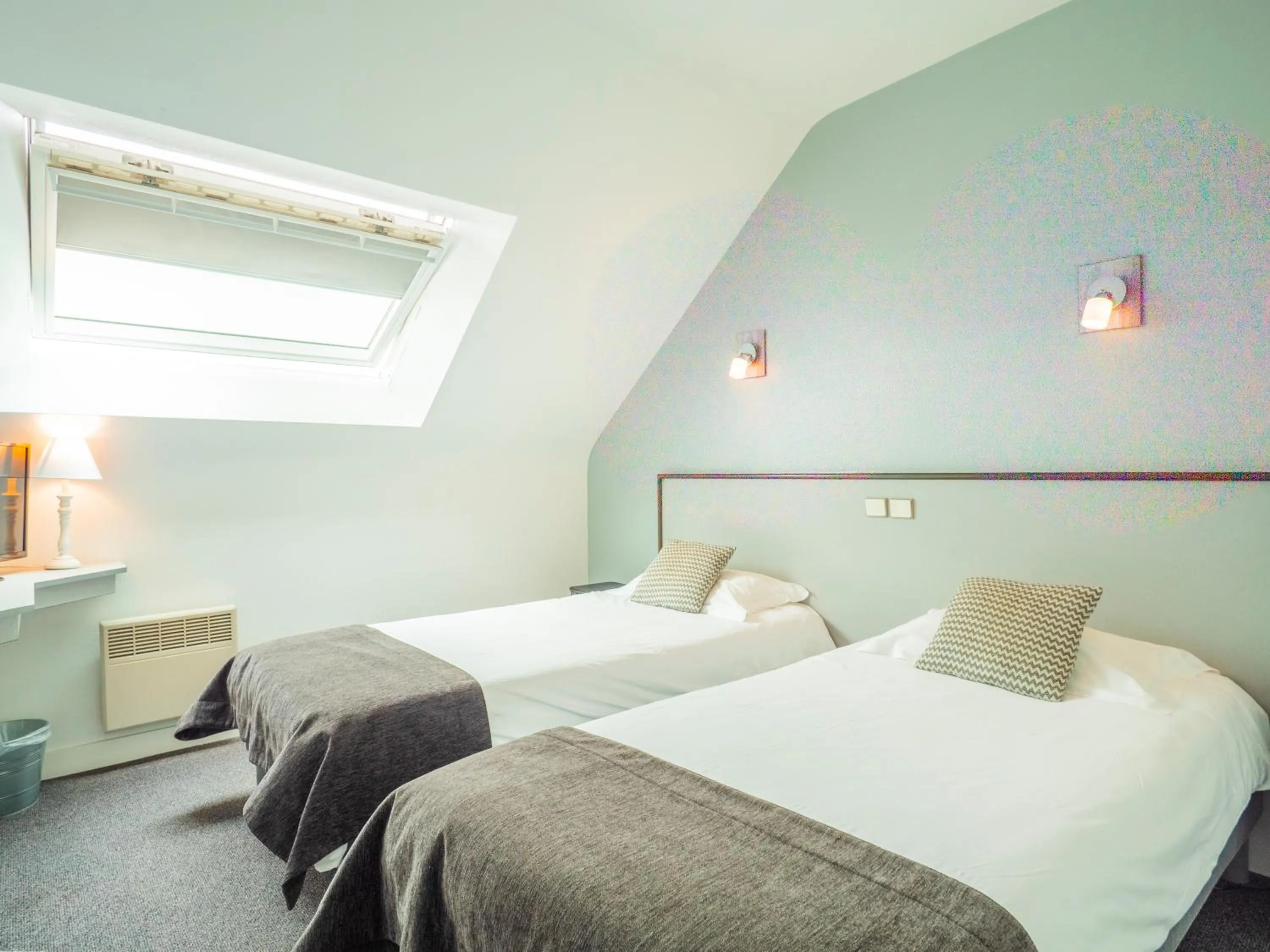 Bed in Hotel La Licorne