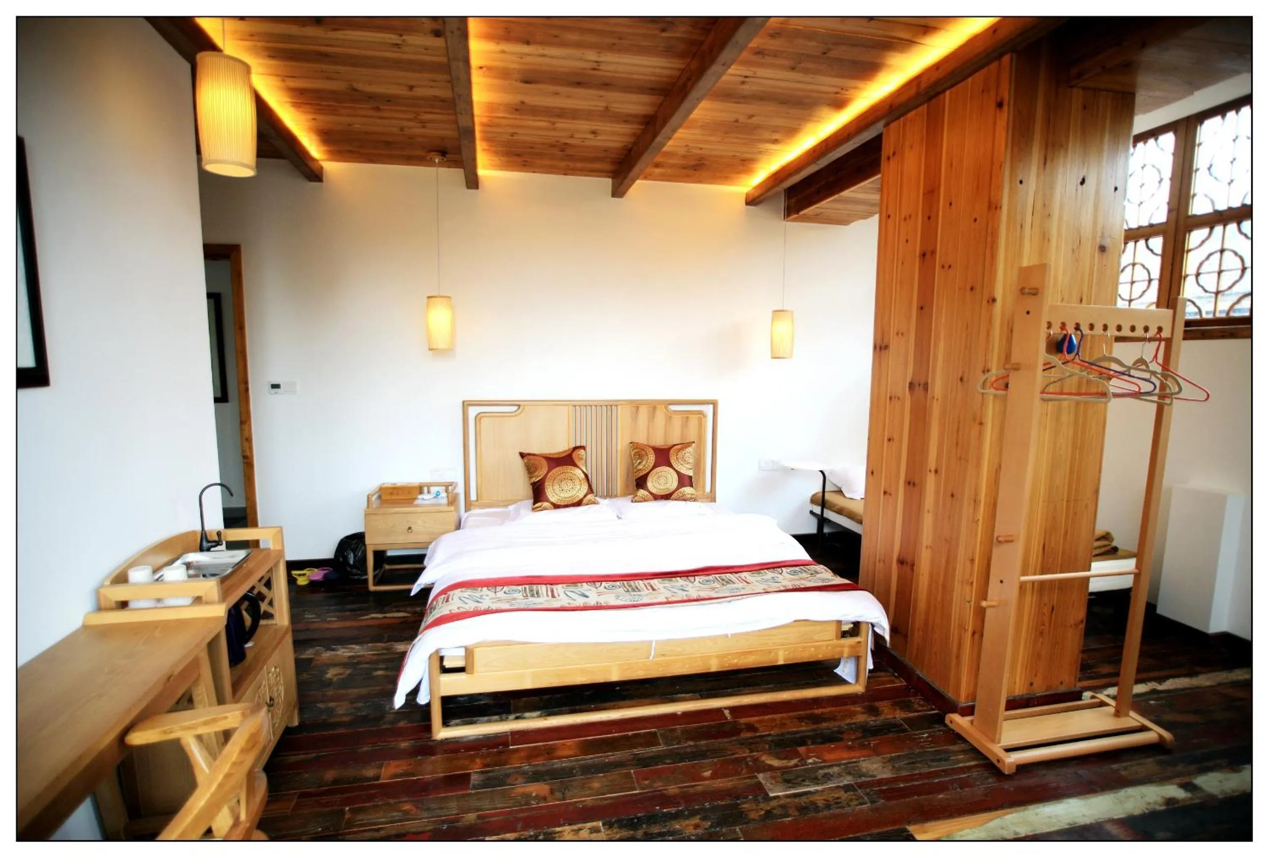 Bed in Tongli Begonia Flowers Guesthouse