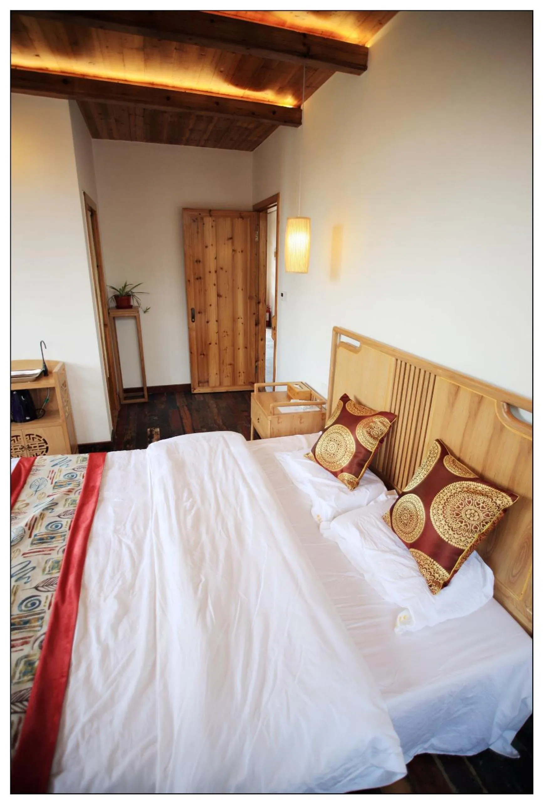 Bed in Tongli Begonia Flowers Guesthouse