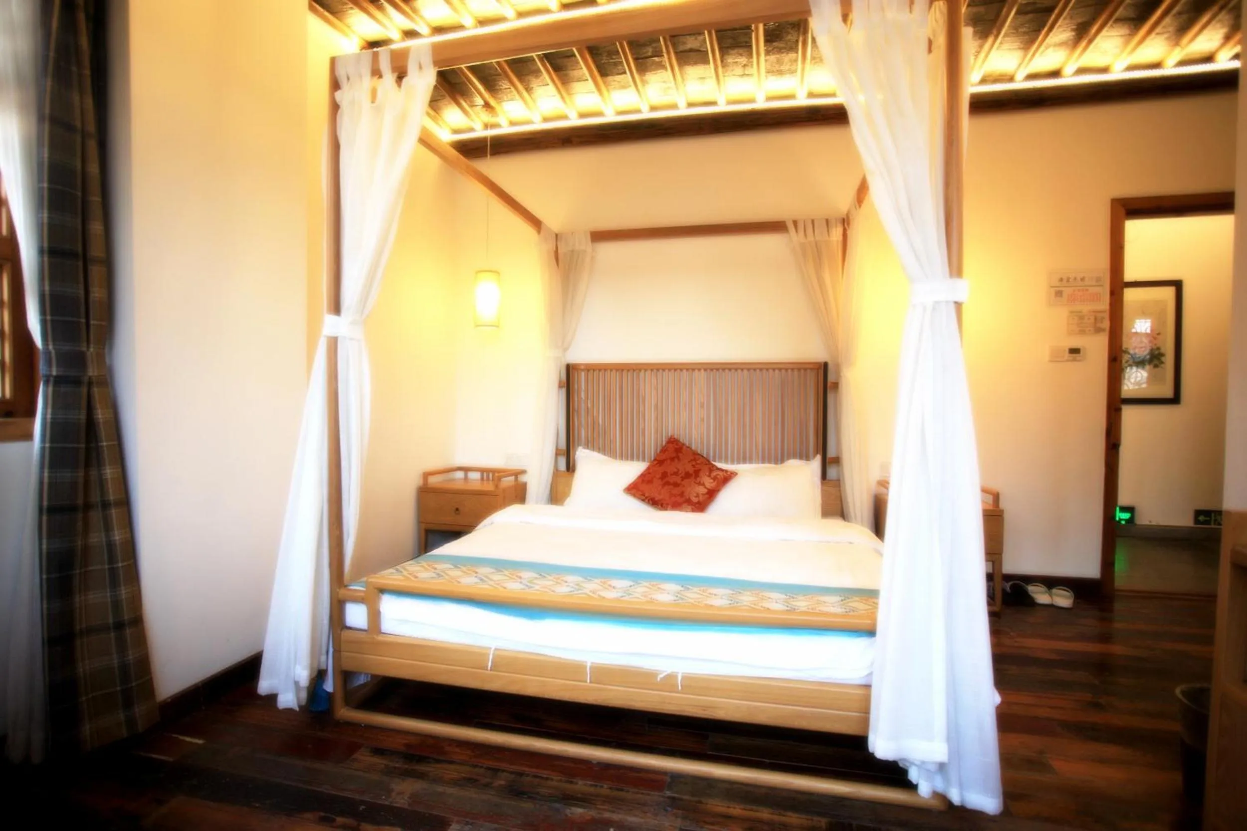 Bed in Tongli Begonia Flowers Guesthouse