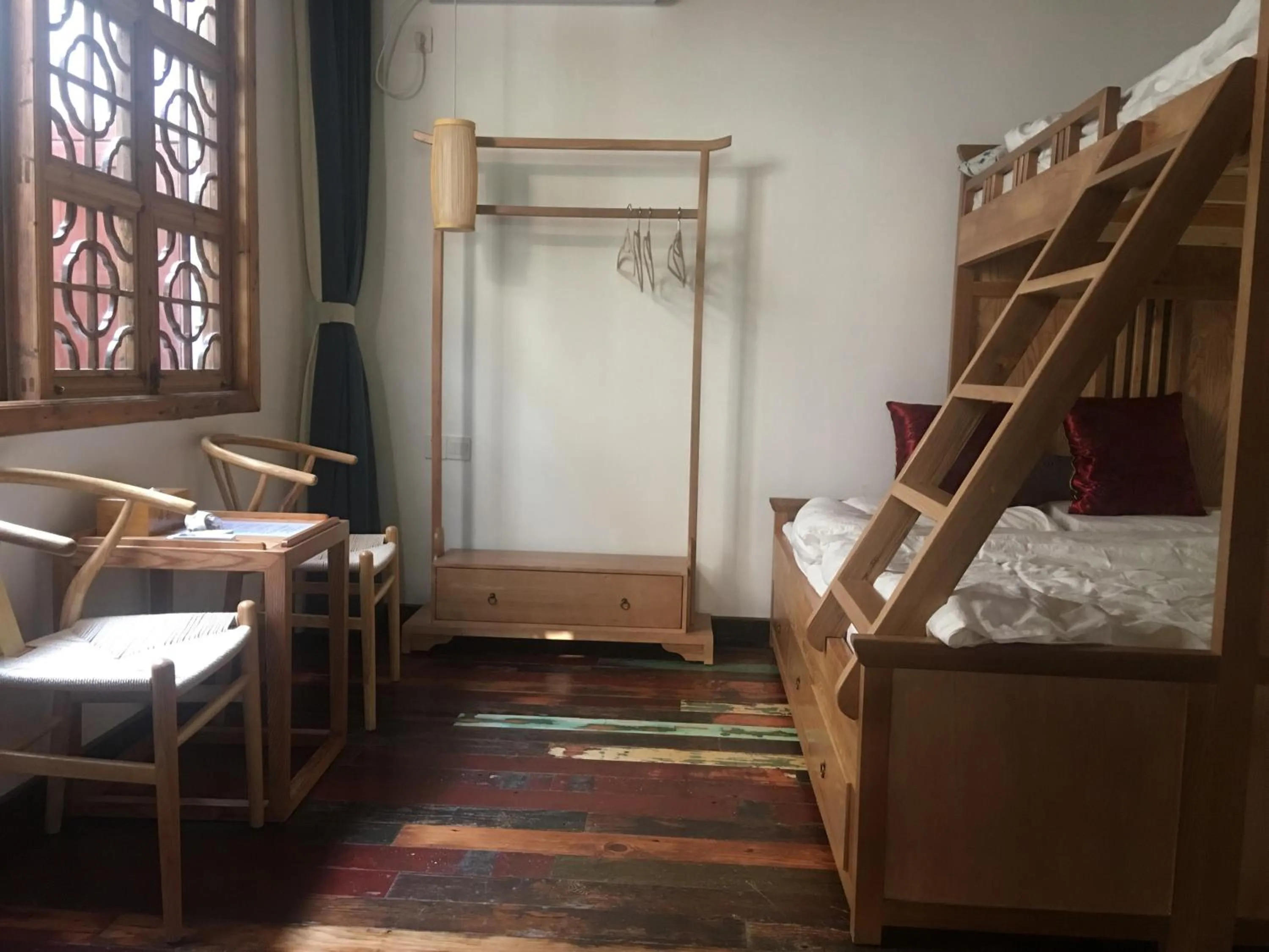 Bed in Tongli Begonia Flowers Guesthouse