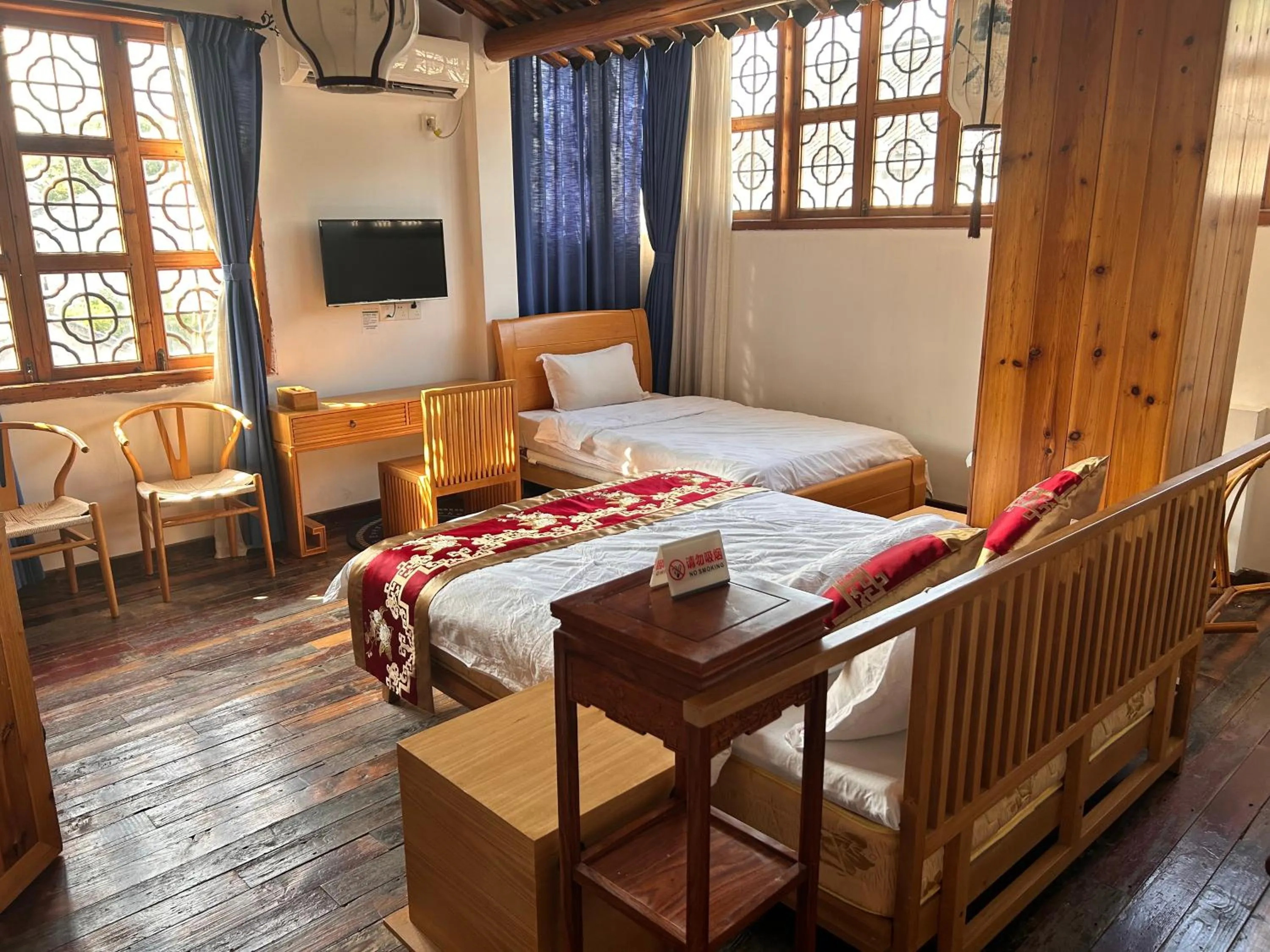 Bed in Tongli Begonia Flowers Guesthouse