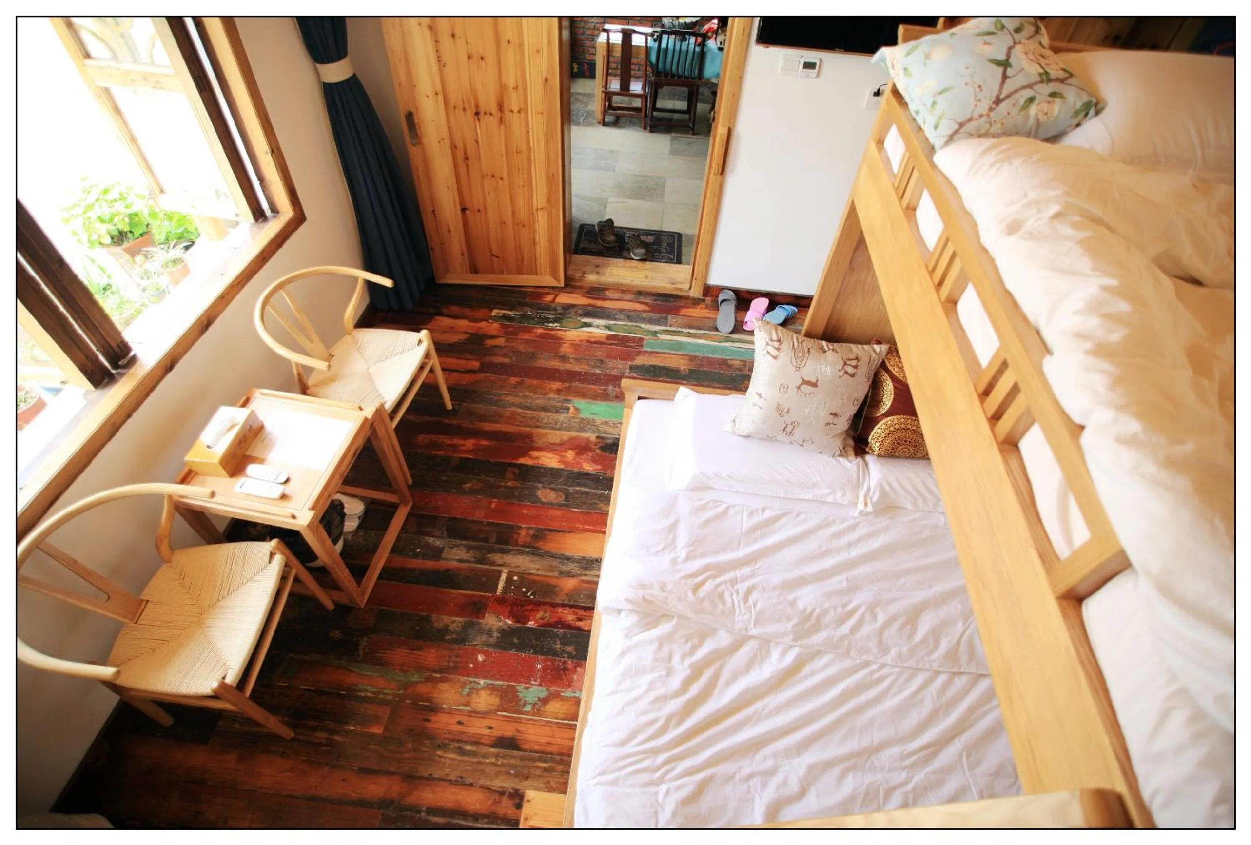 Bed in Tongli Begonia Flowers Guesthouse