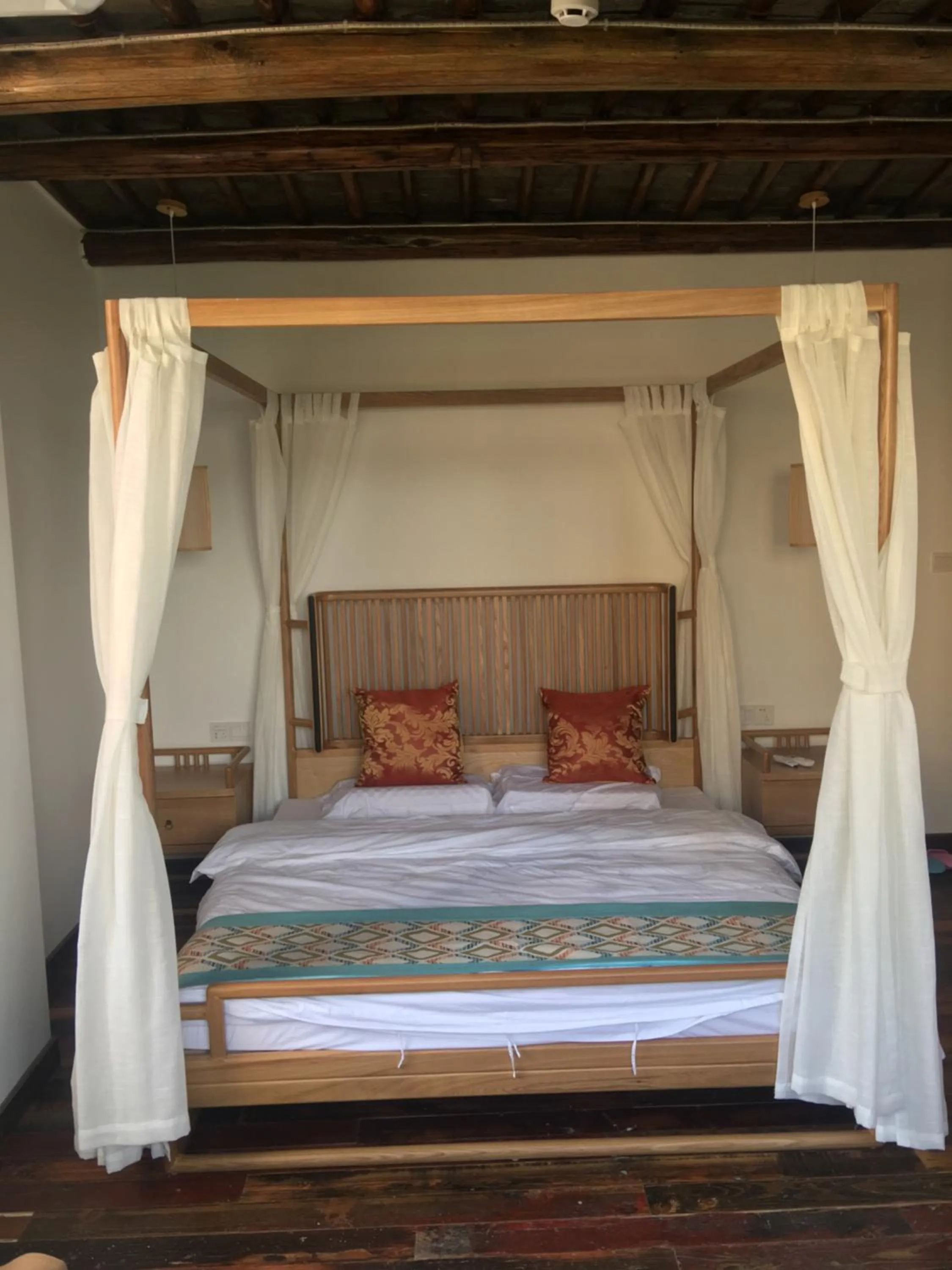 Bed in Tongli Begonia Flowers Guesthouse