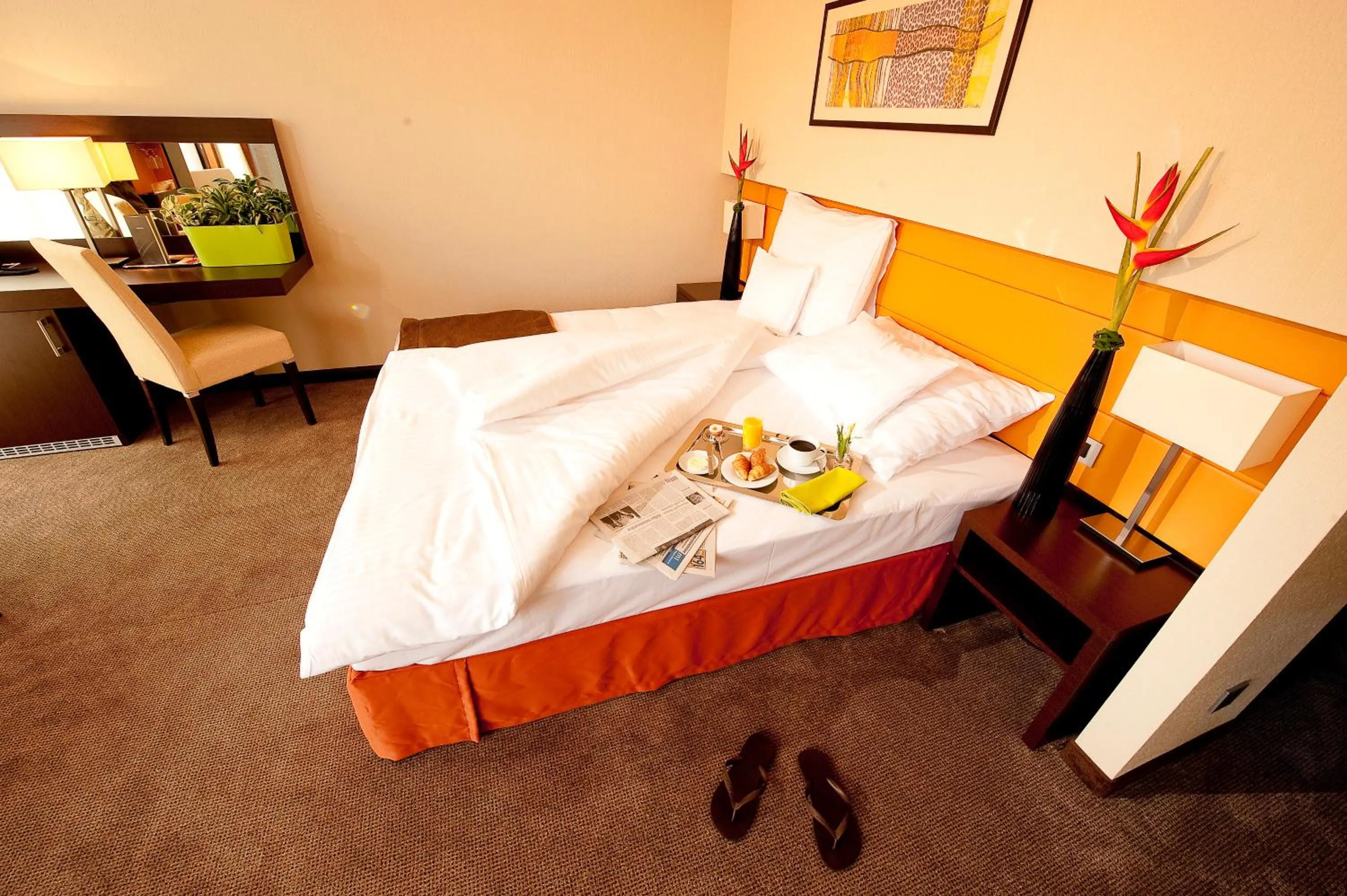 Bed in Abacus Business & Wellness Hotel