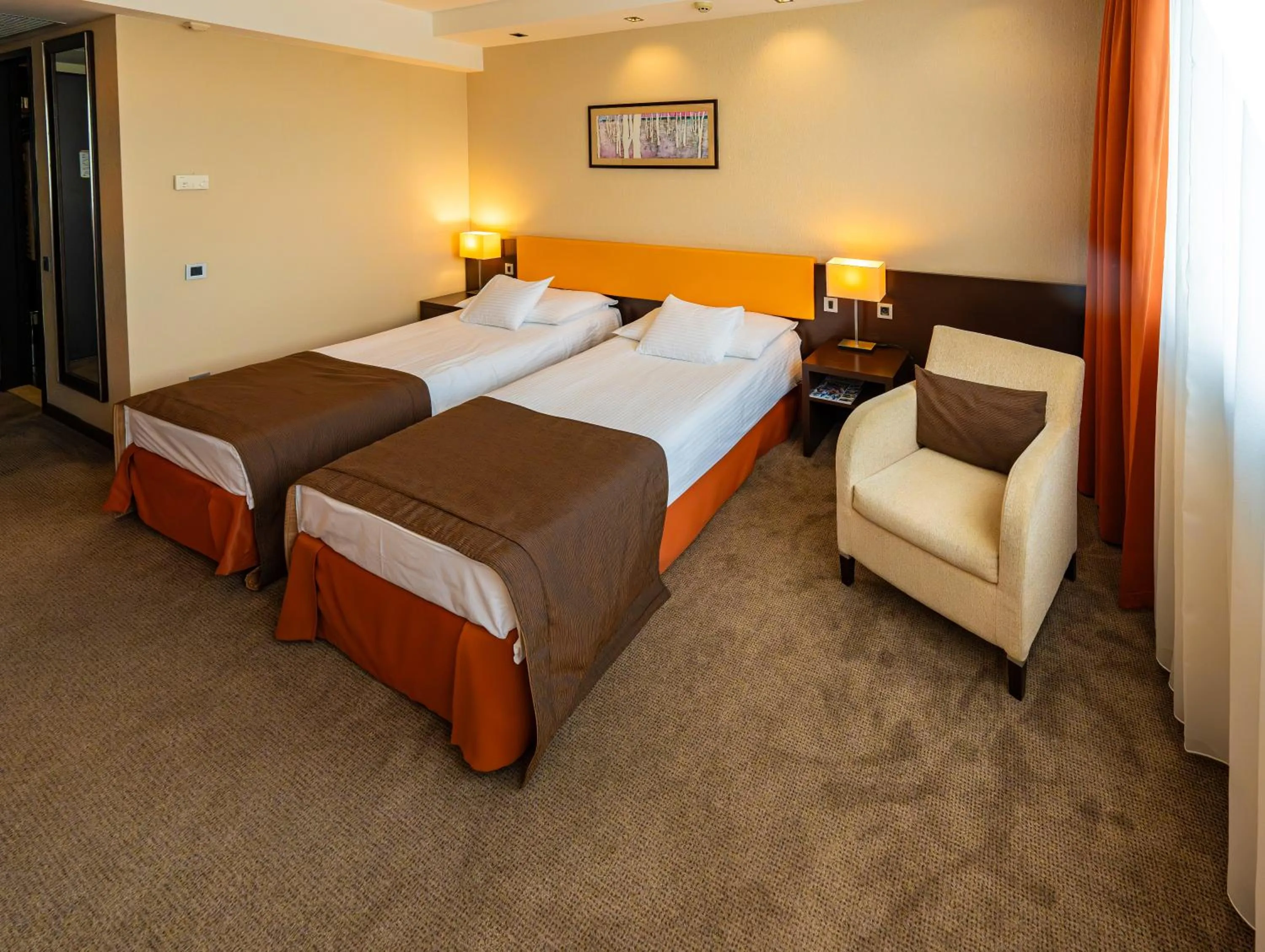 Bed in Abacus Business & Wellness Hotel