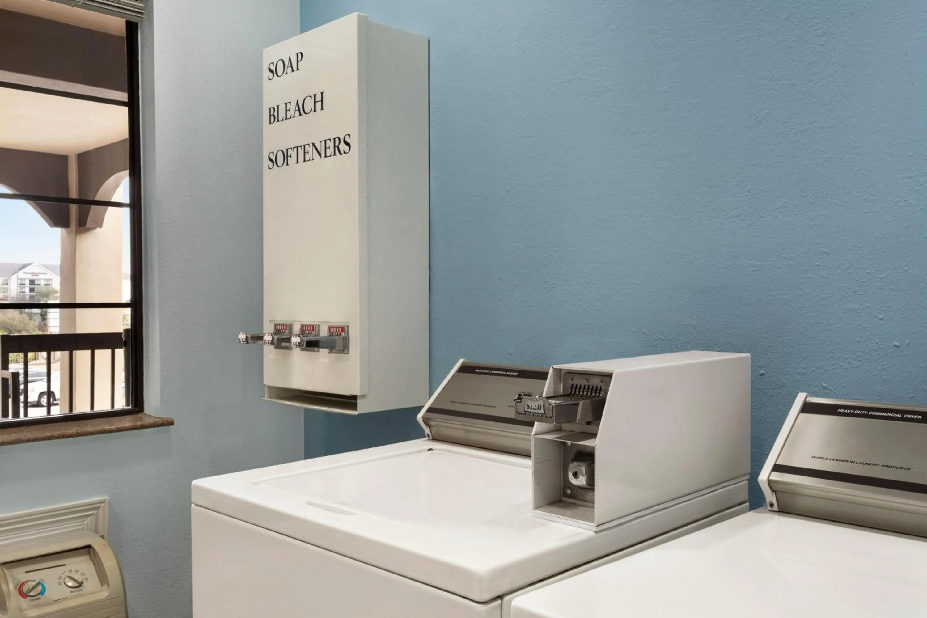 laundry in Days Inn & Suites by Wyndham Houston Hobby Airport