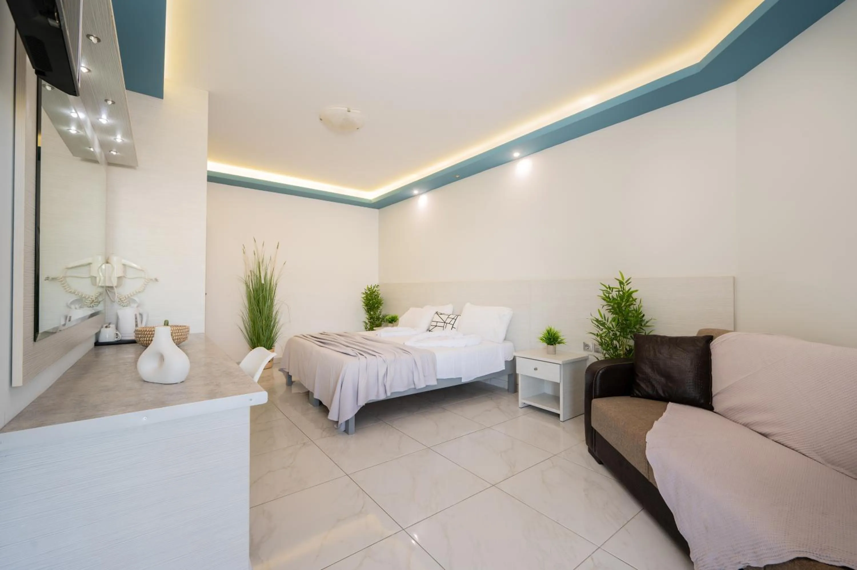 Seating area, Bed in Callinica Hotel