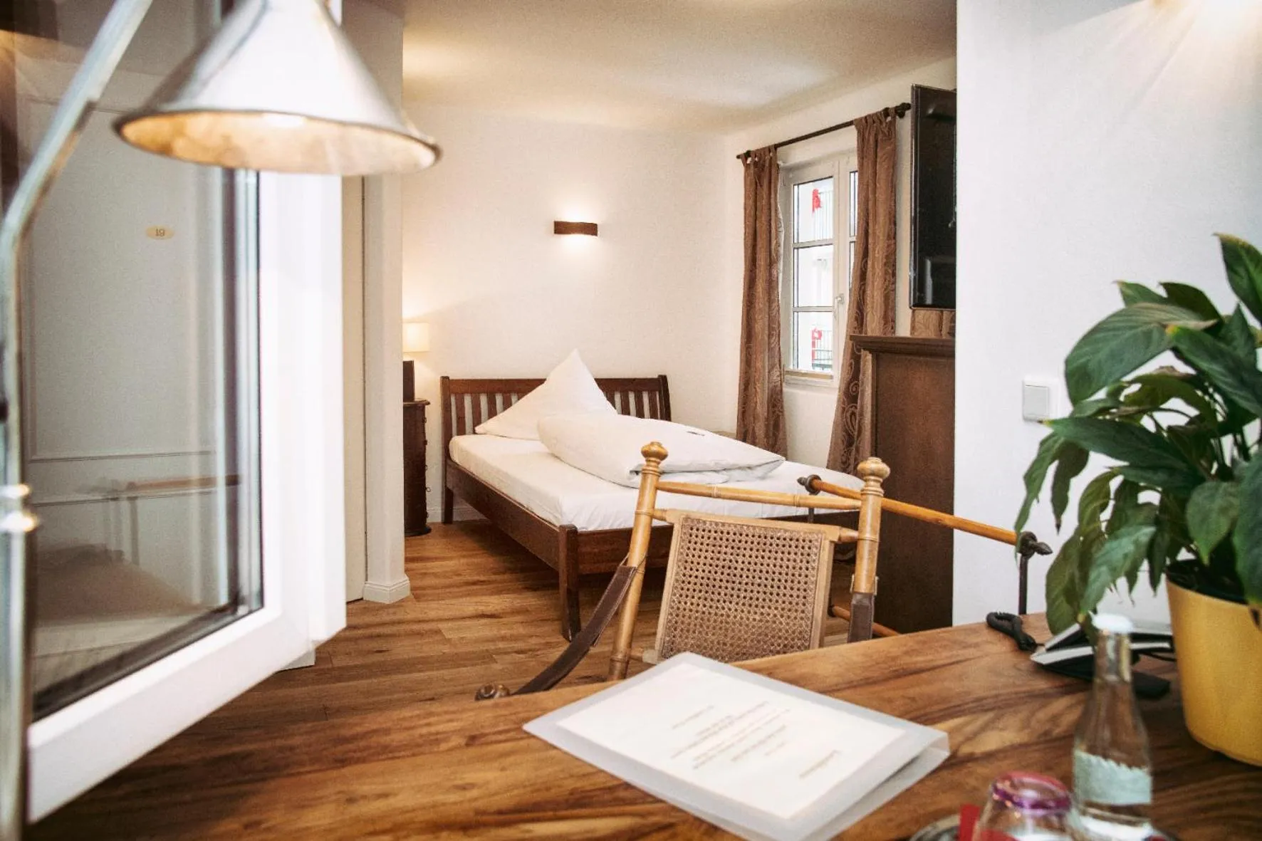 Photo of the whole room, Bed in Landhaus Hotel Wolfratshausen