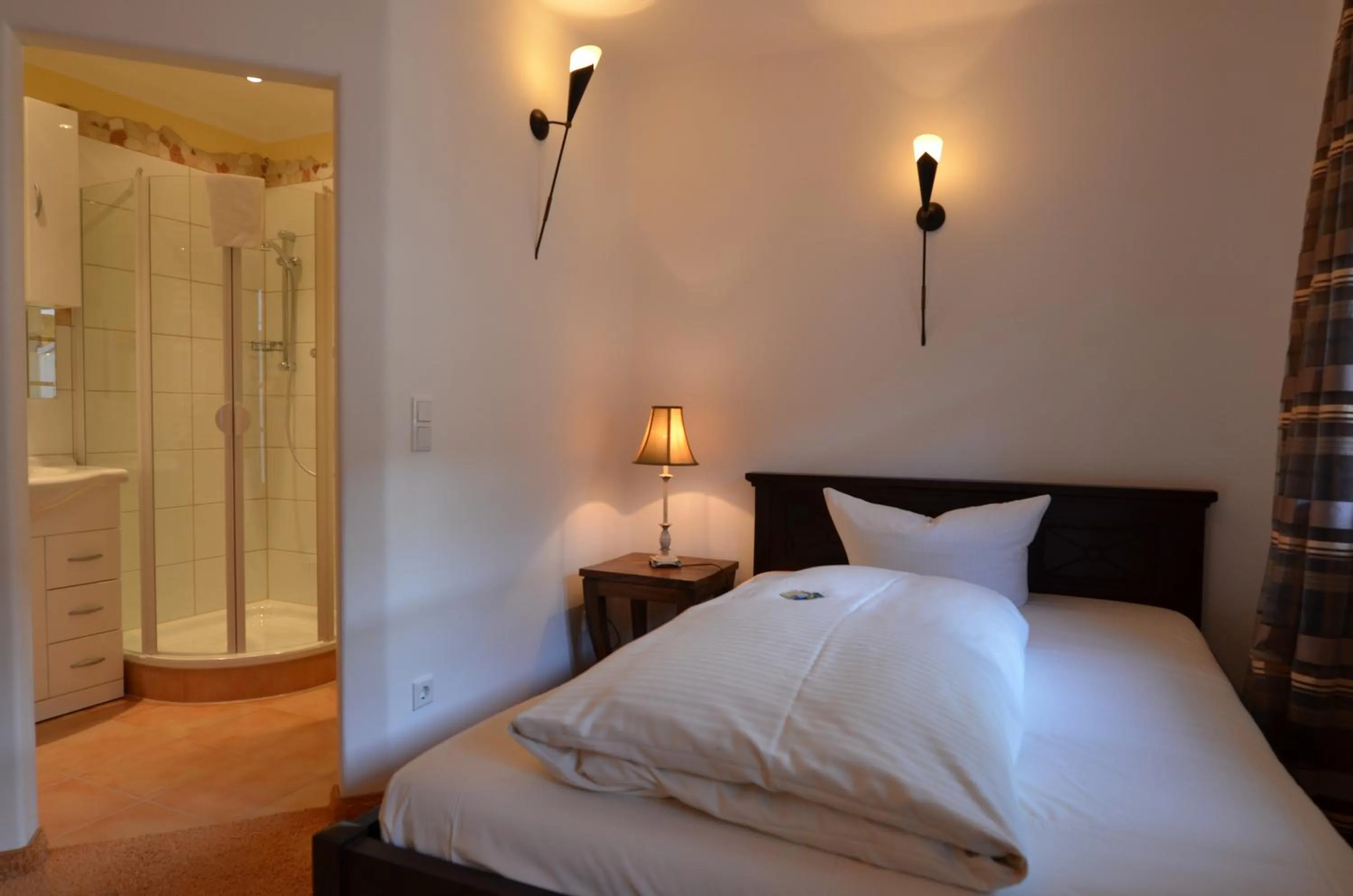 Photo of the whole room, Bed in Landhaus Hotel Wolfratshausen