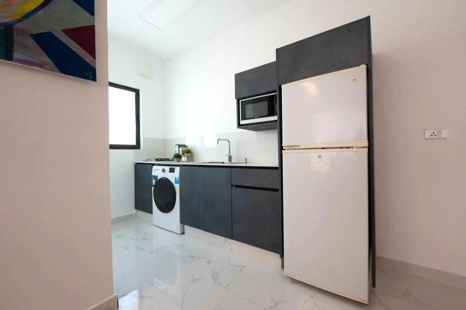 Kitchen or kitchenette in Al Kawther Hotel Apartments