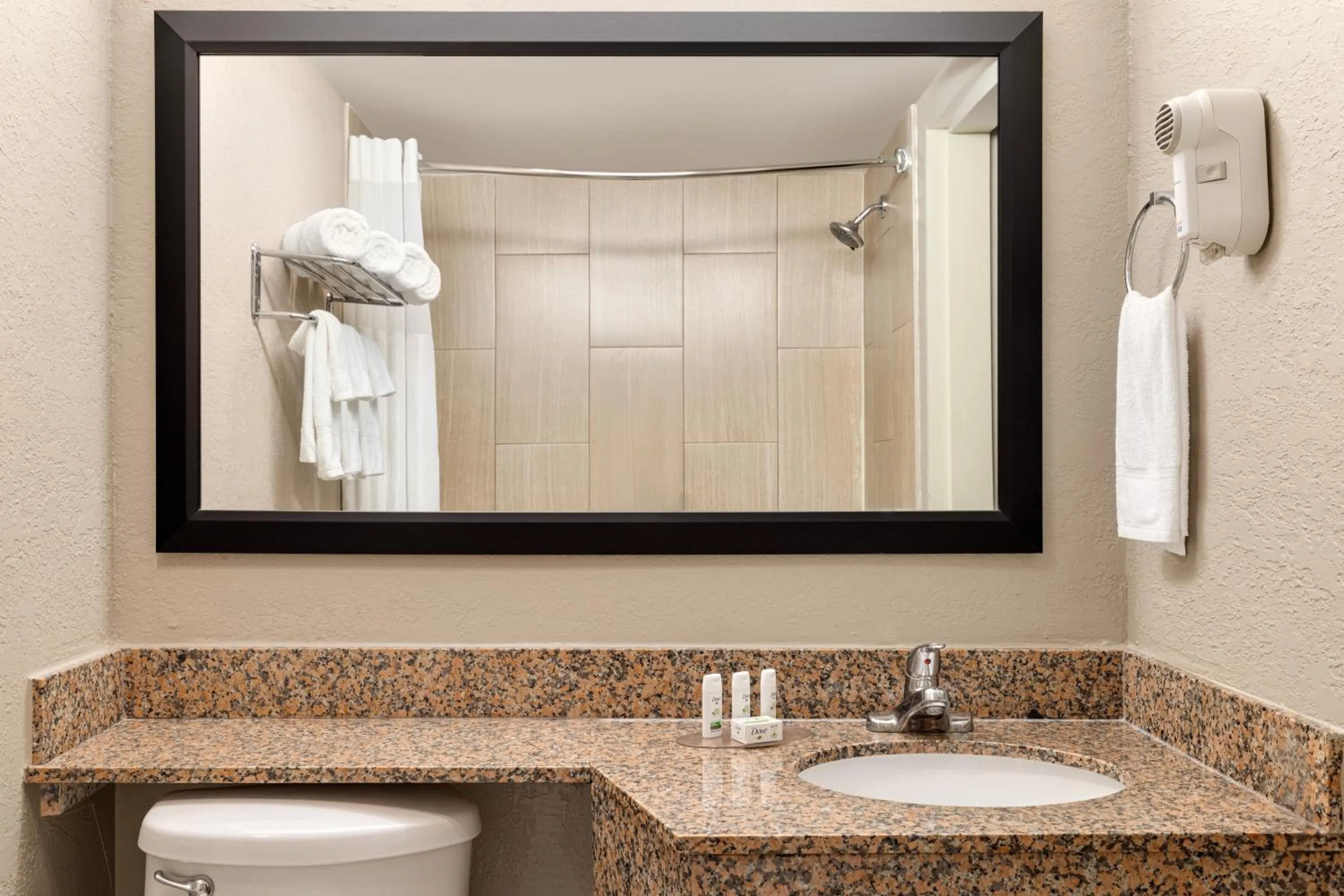 Bathroom in AmericInn by Wyndham Grand Rapids Airport North