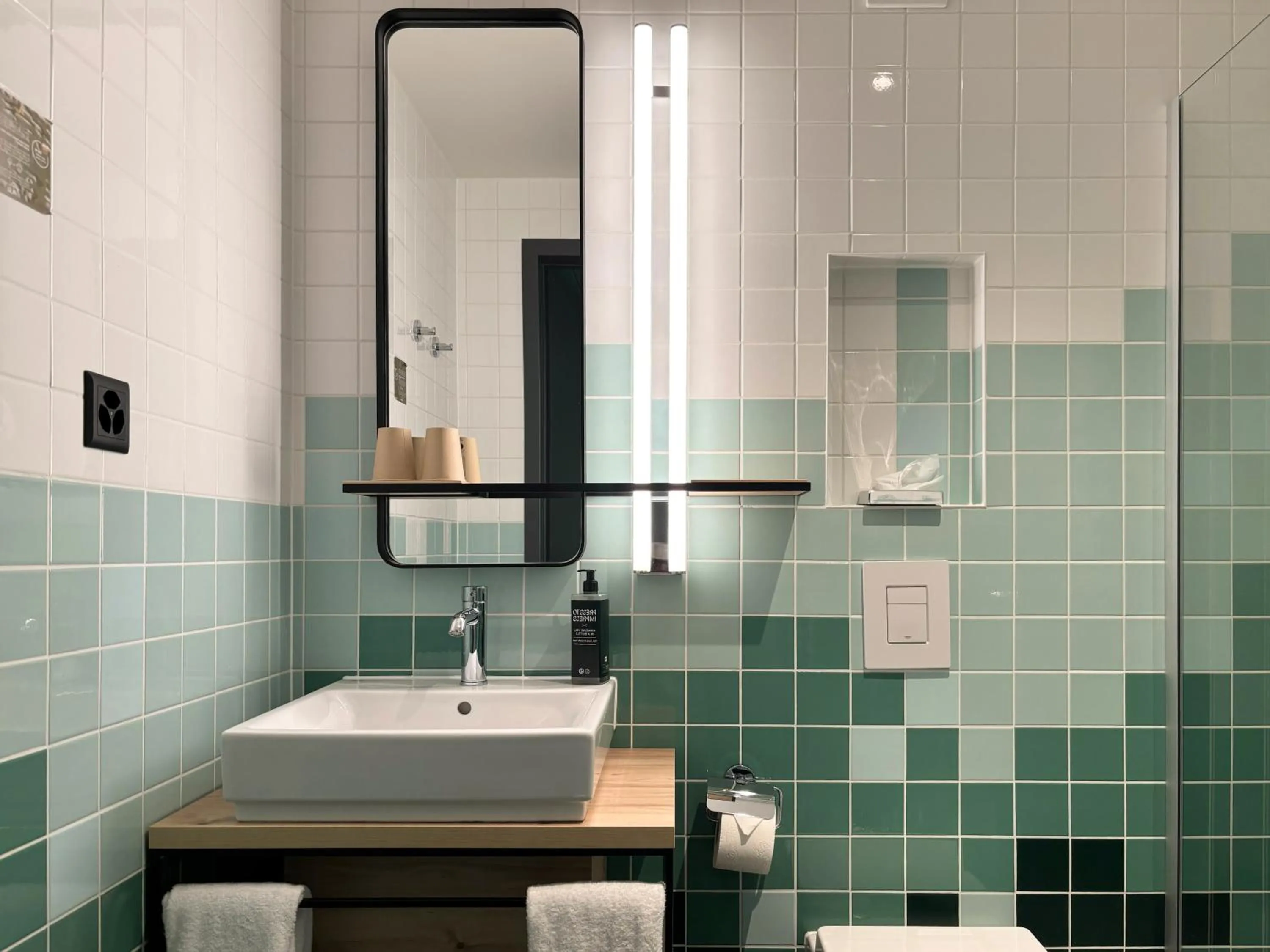 Bathroom in Nonanteneuf appart hōtel Sierre - contactless check-in