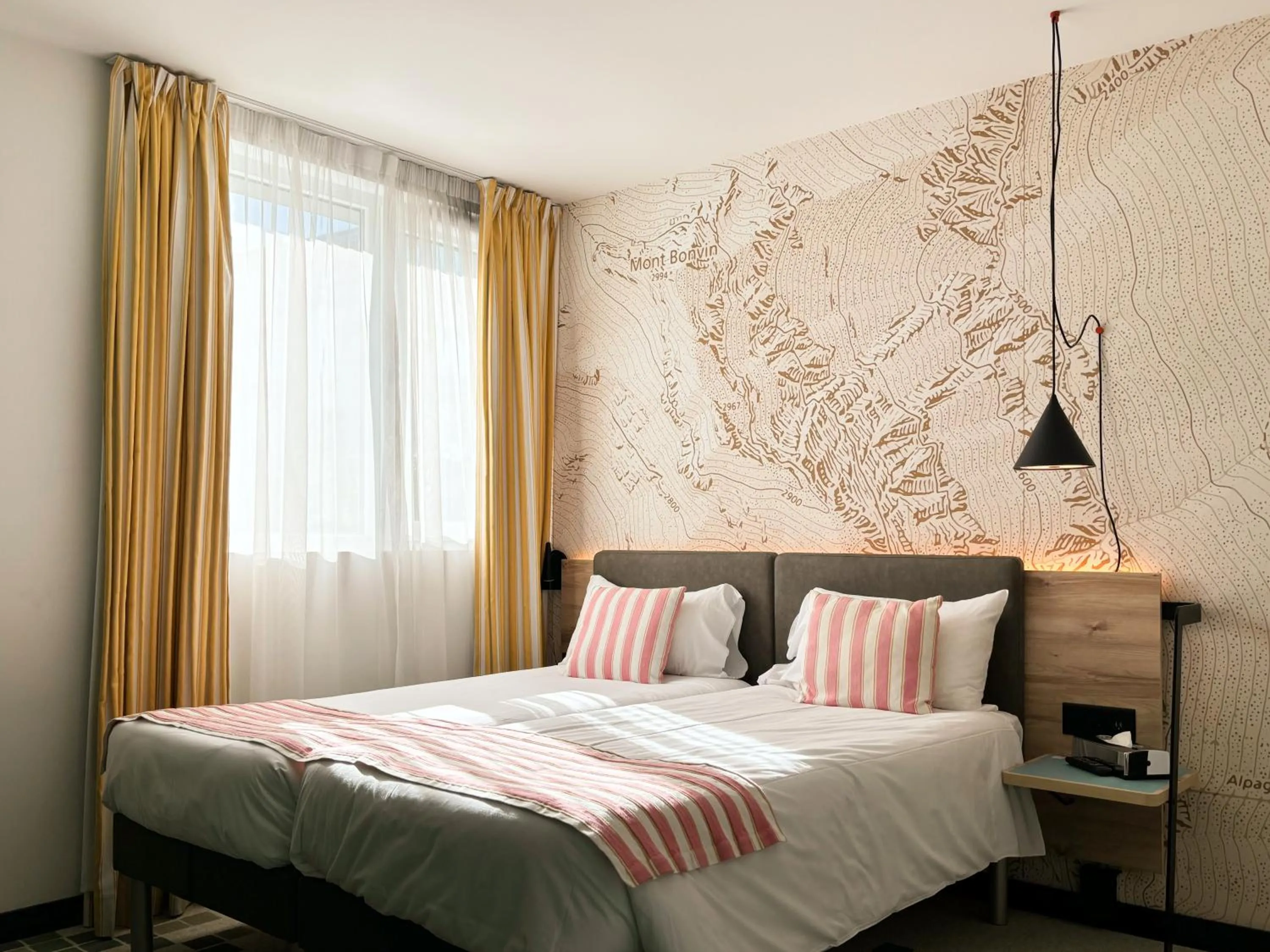 Bed in Nonanteneuf appart hōtel Sierre - contactless check-in