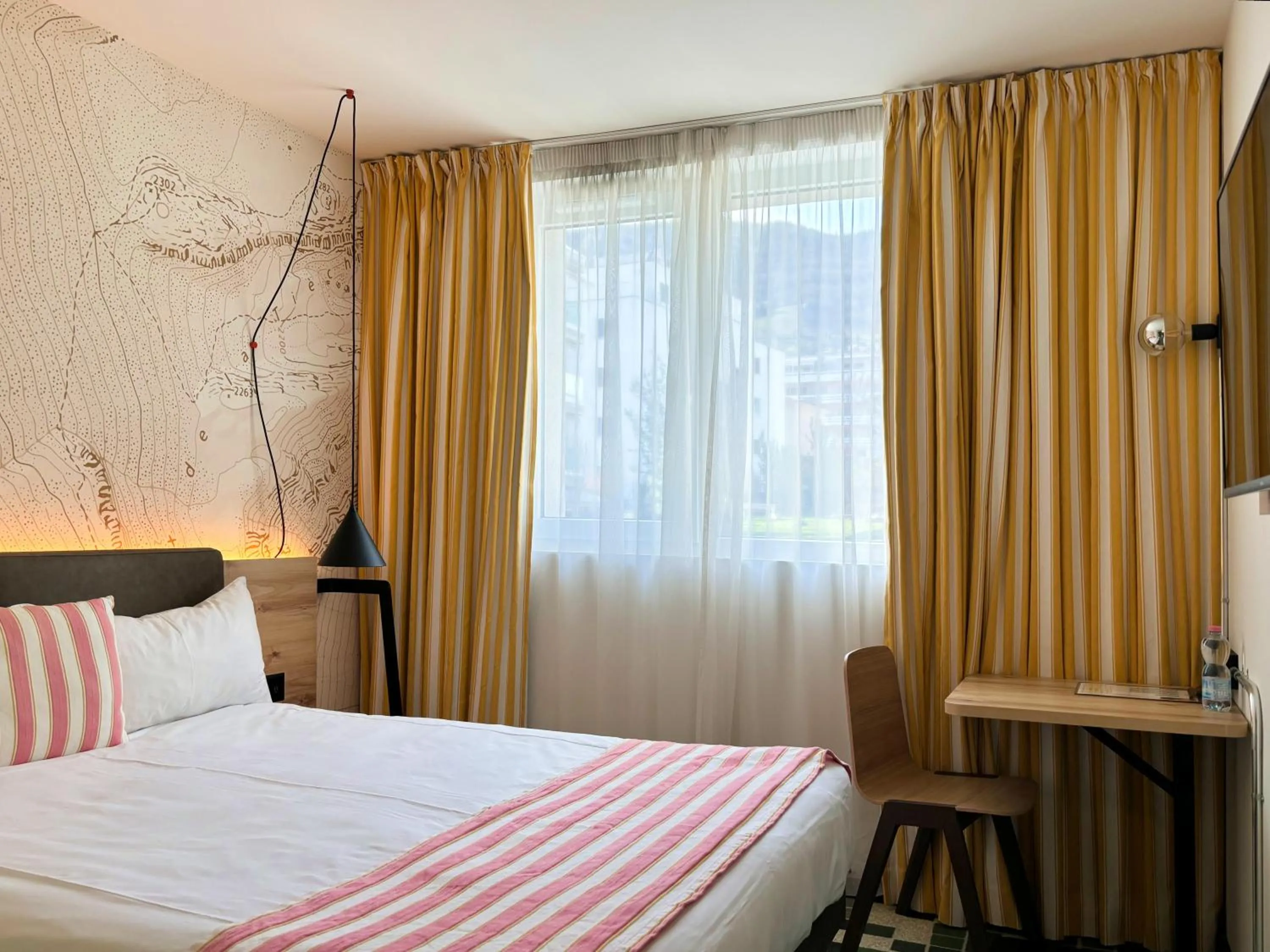 Bed in Nonanteneuf appart hōtel Sierre - contactless check-in