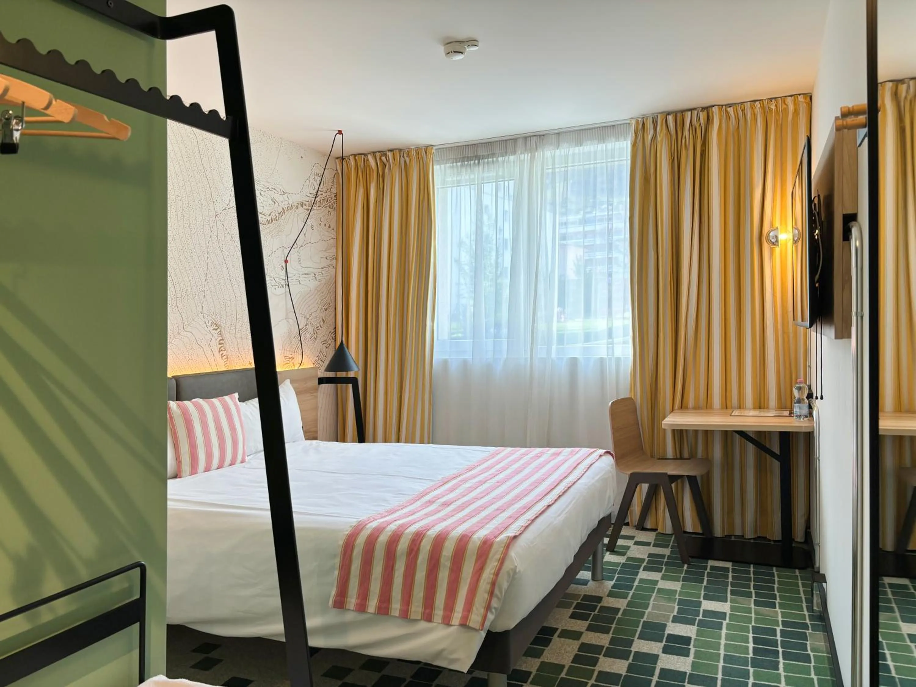 Bed in Nonanteneuf appart hōtel Sierre - contactless check-in