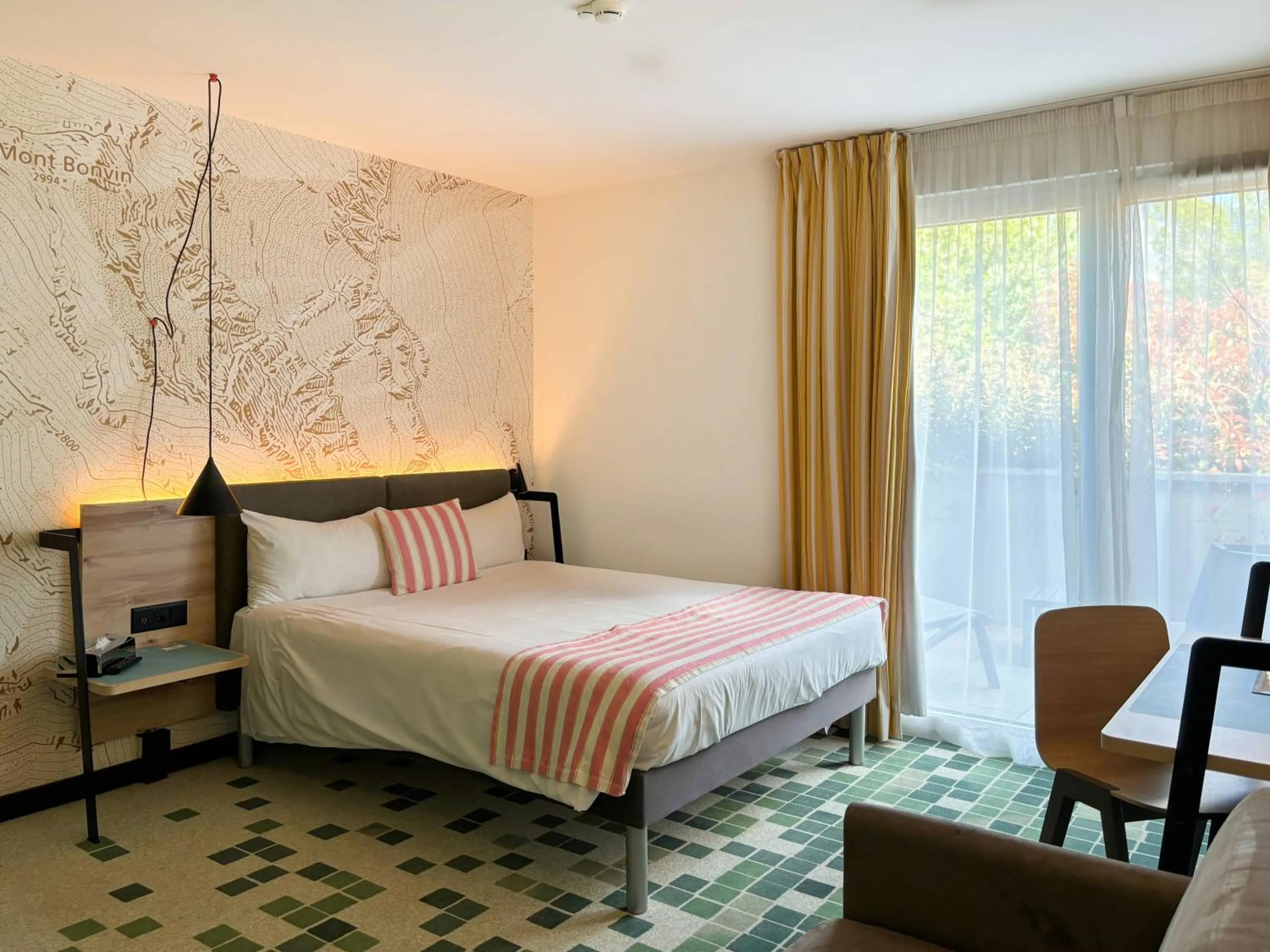 Bed in Nonanteneuf appart hōtel Sierre - contactless check-in