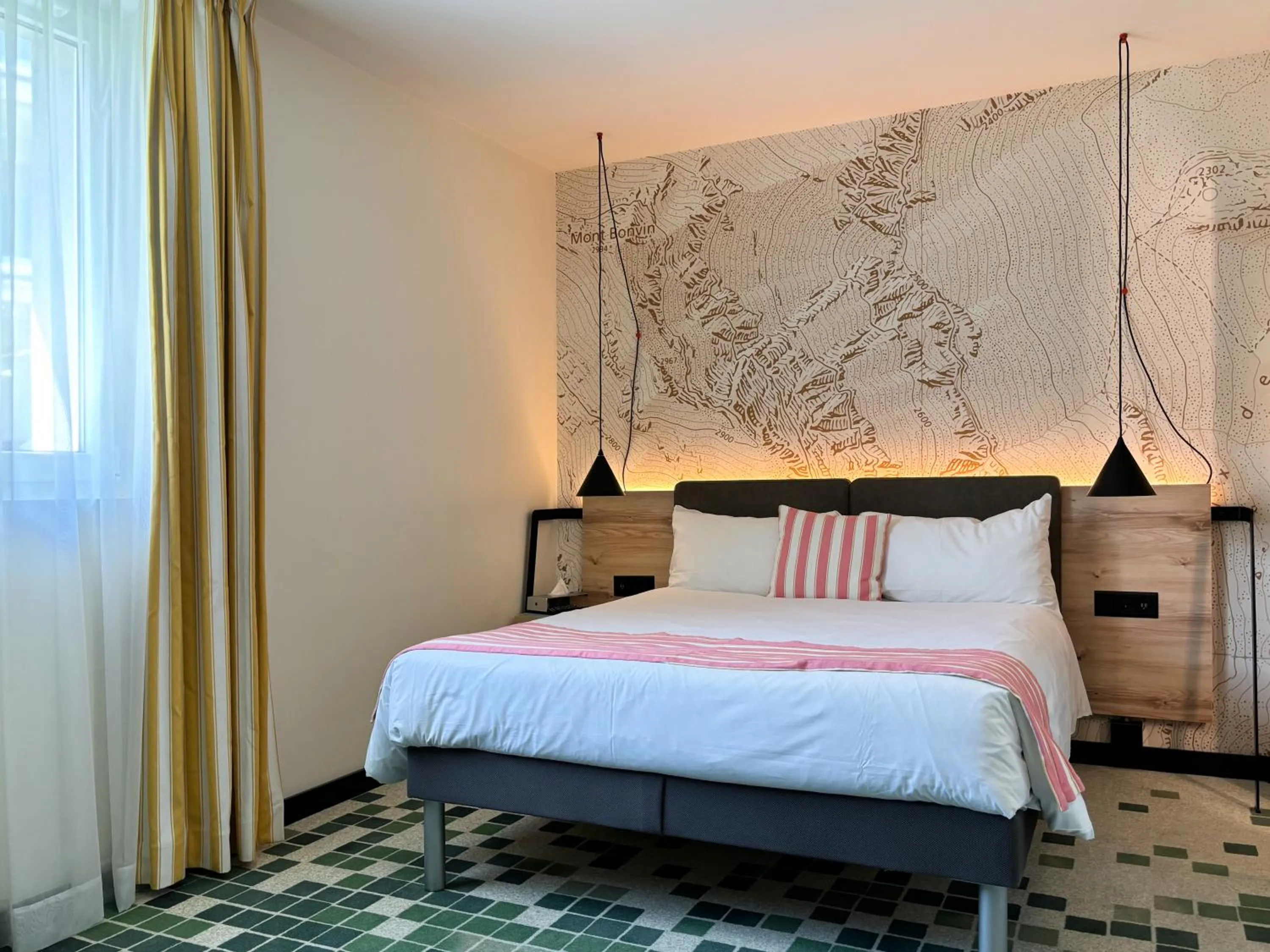 Bed in Nonanteneuf appart hōtel Sierre - contactless check-in