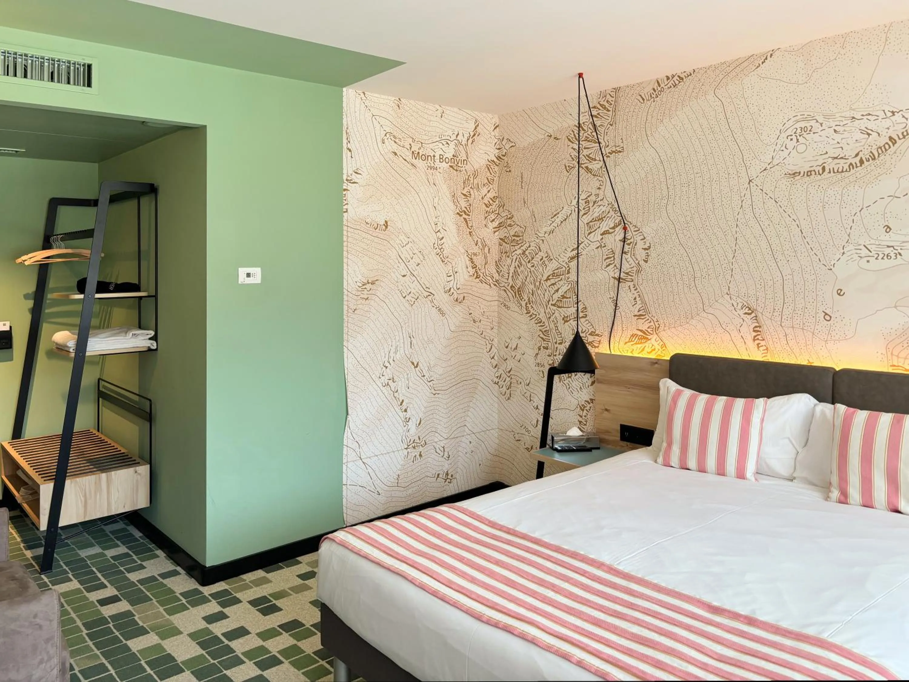 Bed in Nonanteneuf appart hōtel Sierre - contactless check-in