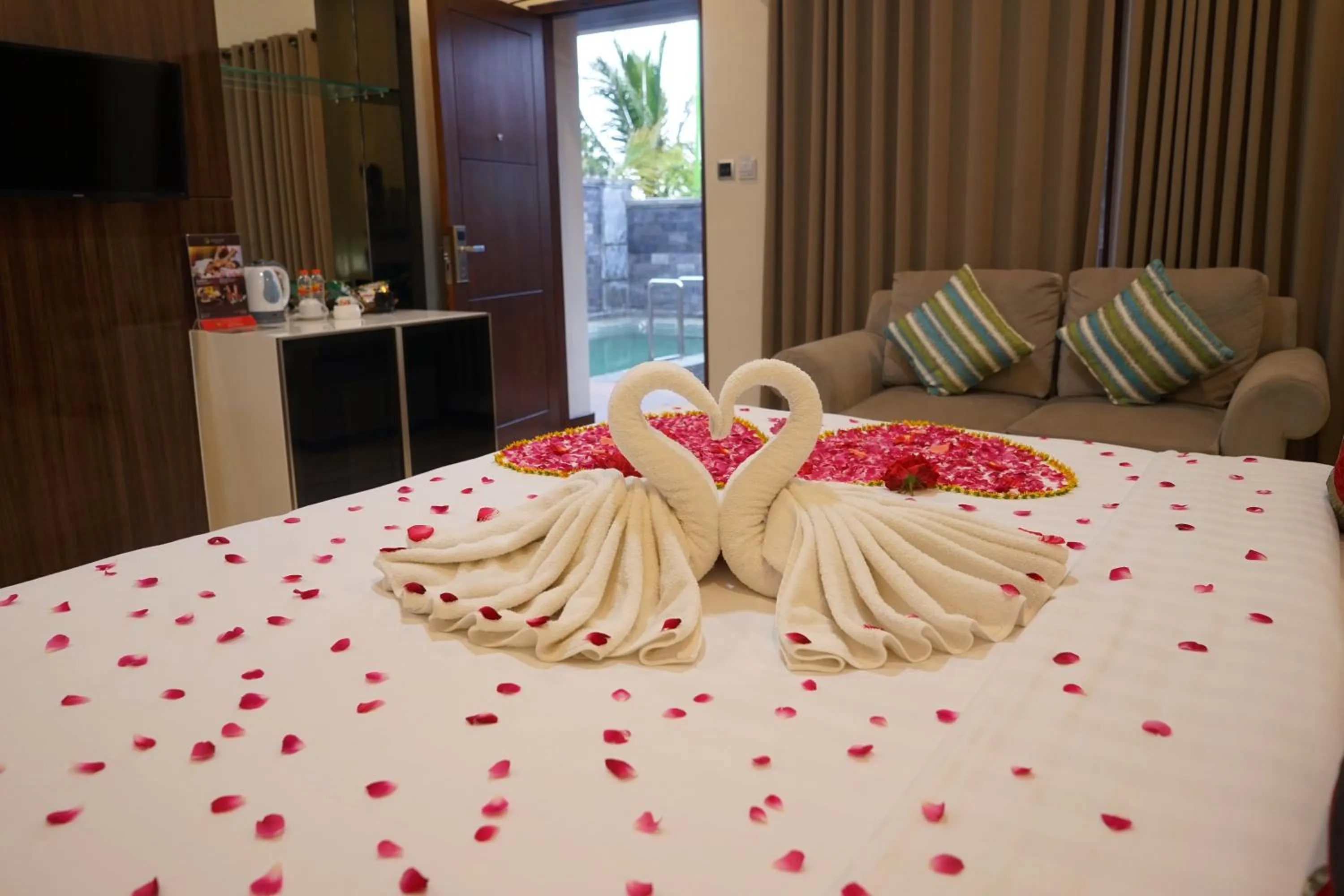 Bed in Grand Harvest Resort & Villas