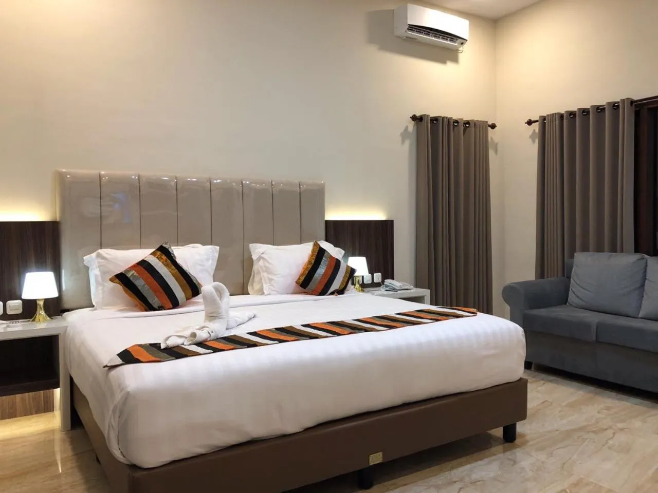 Bed in Grand Harvest Resort & Villas