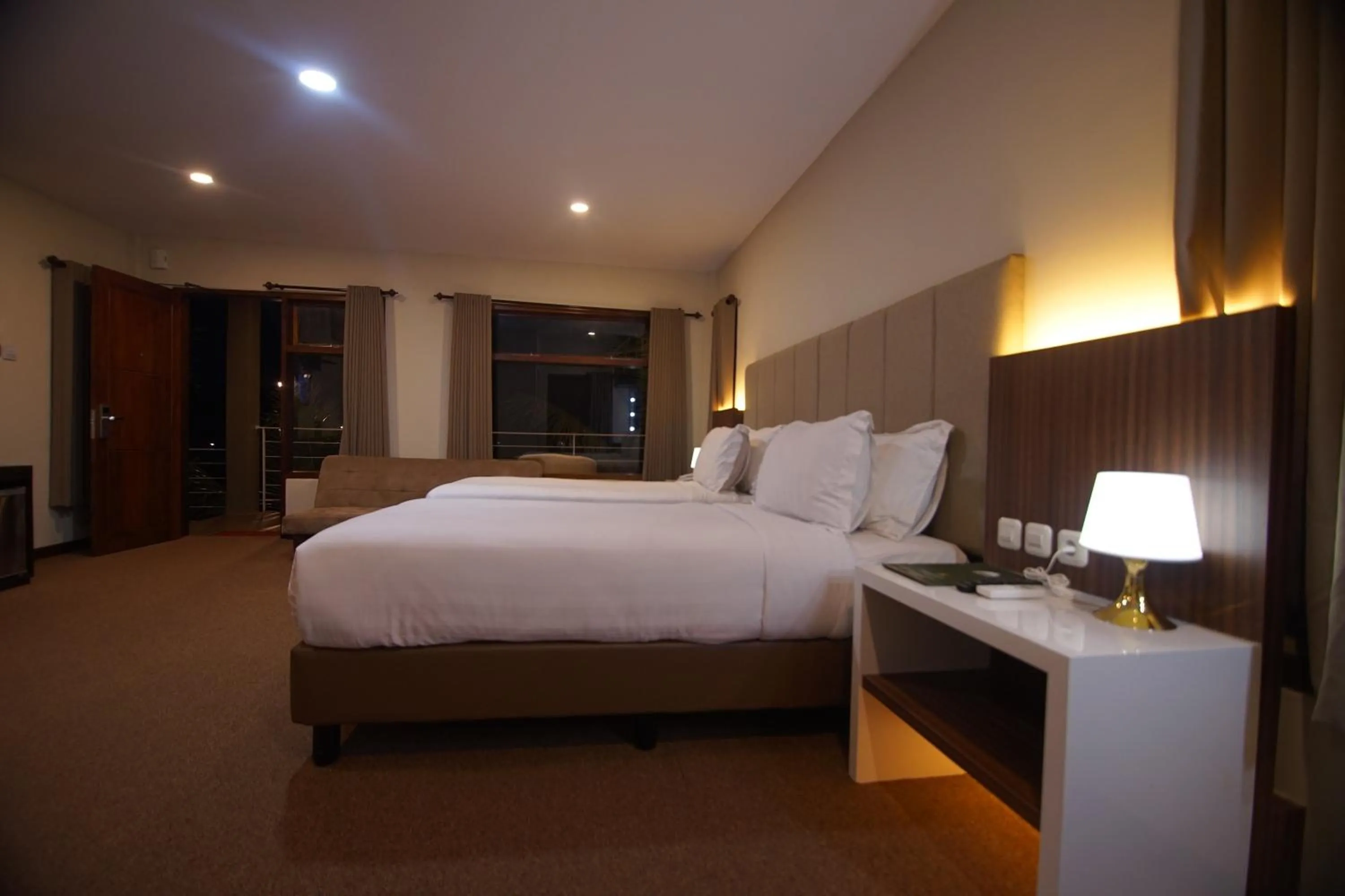Bed in Grand Harvest Resort & Villas