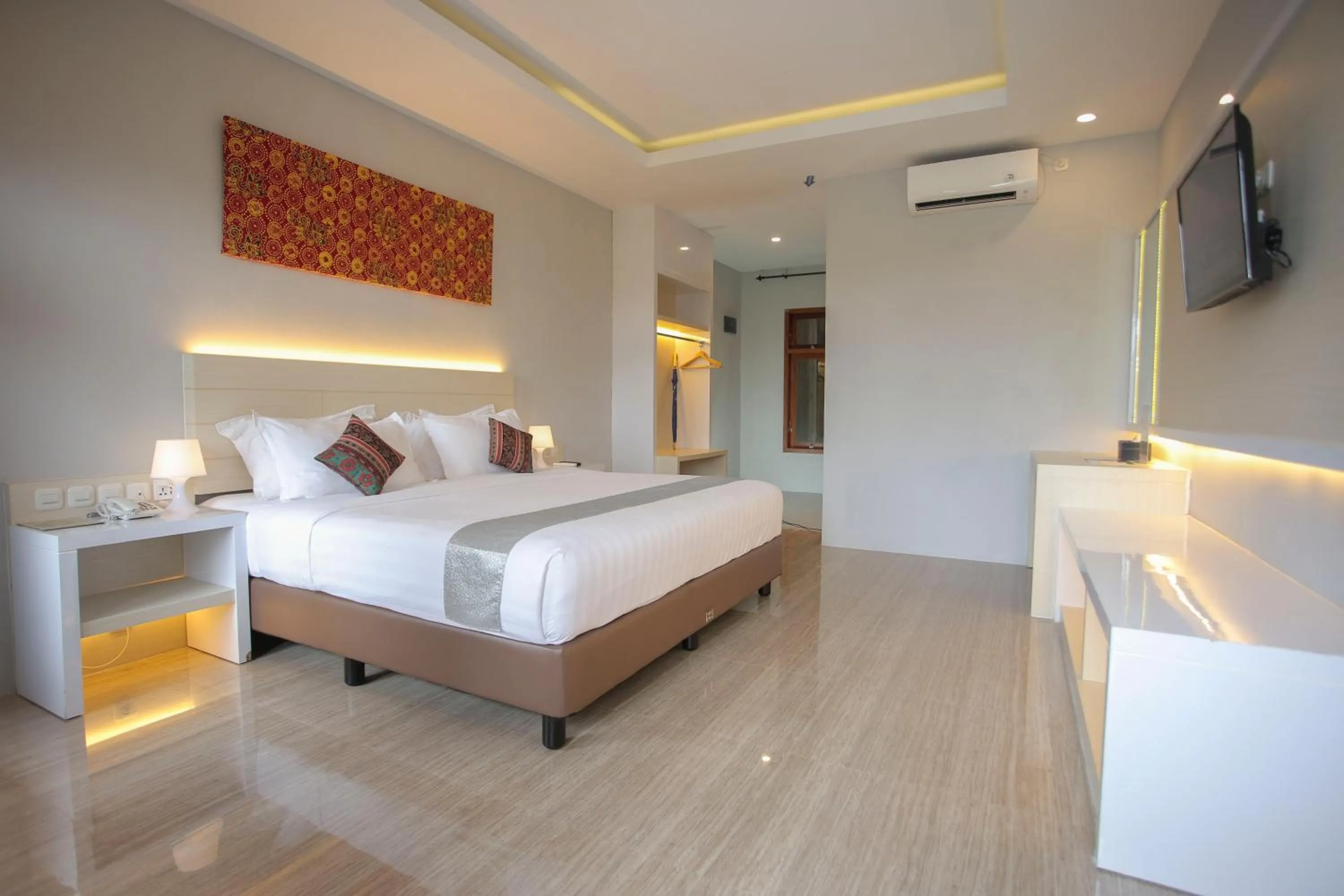 Bed in Grand Harvest Resort & Villas