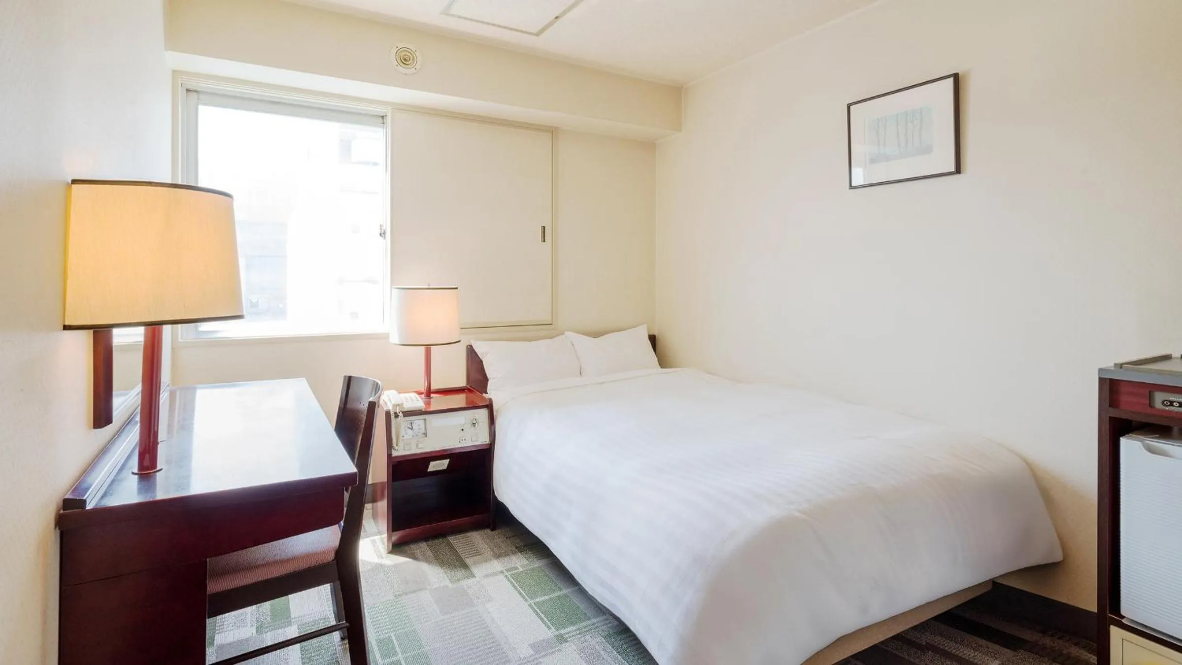 Bed in Hotel Paco Obihiro Chuo