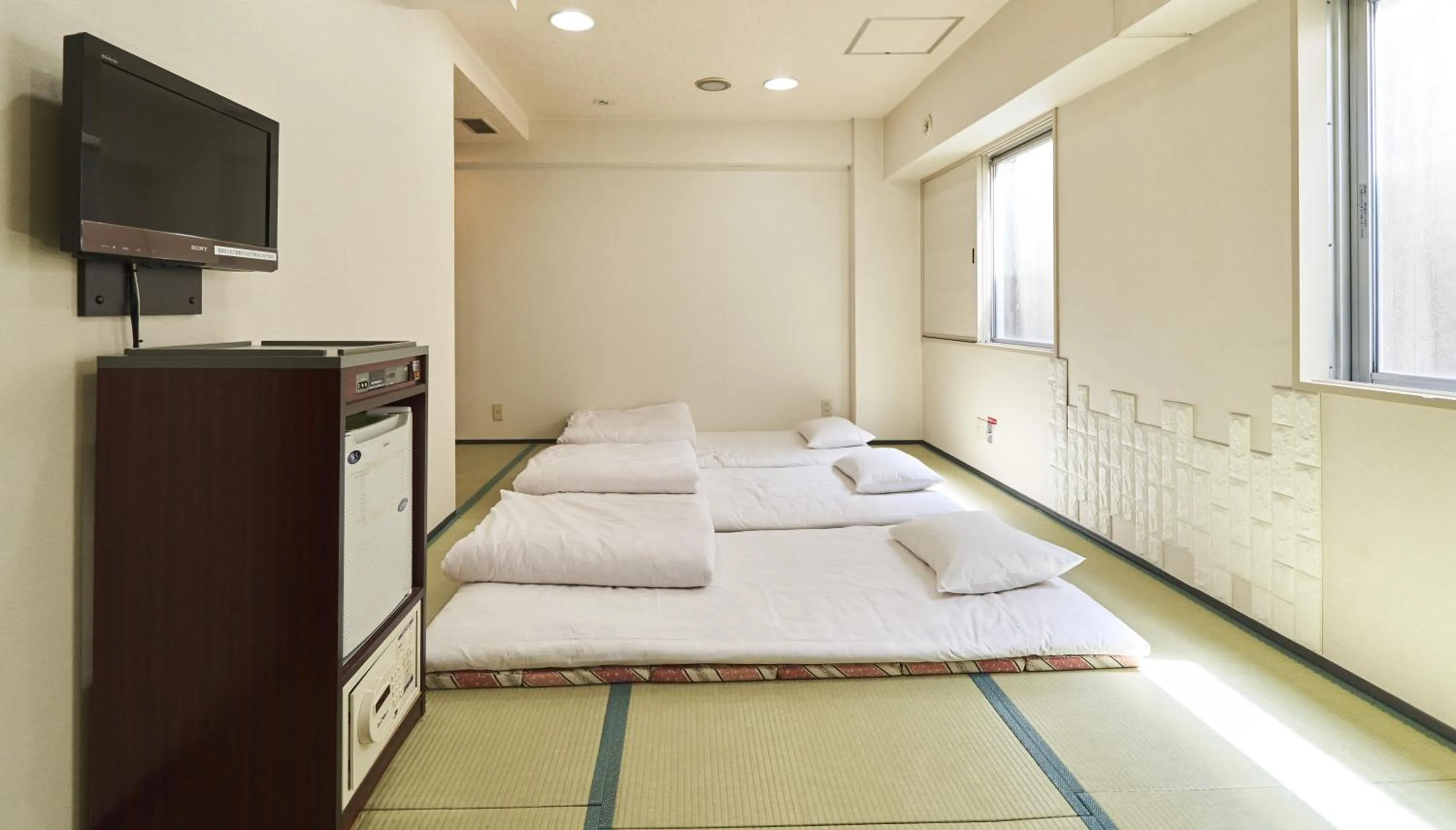 Bed in Hotel Paco Obihiro Chuo