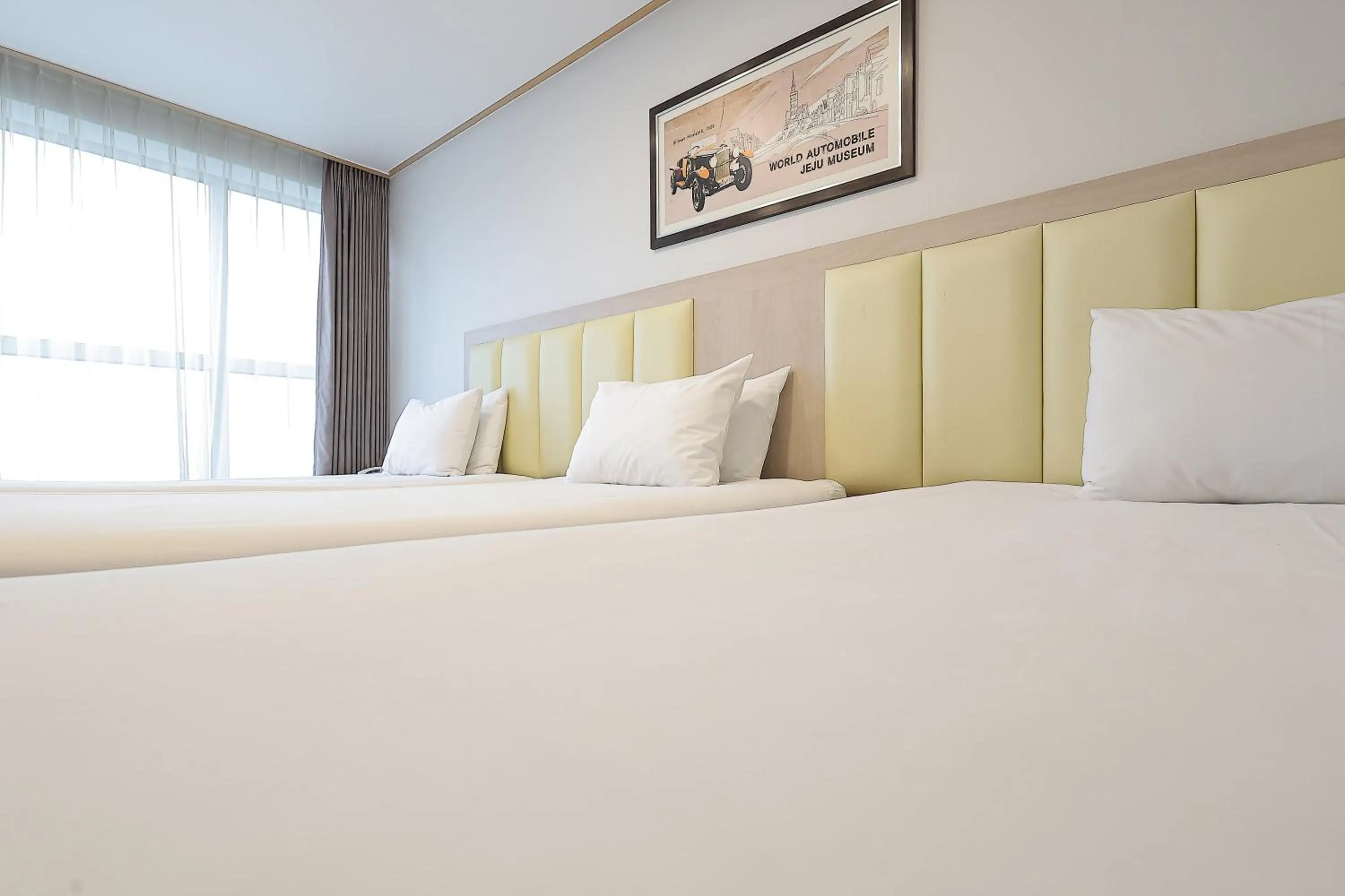 Bed in Shin Shin Hotel Jeju City