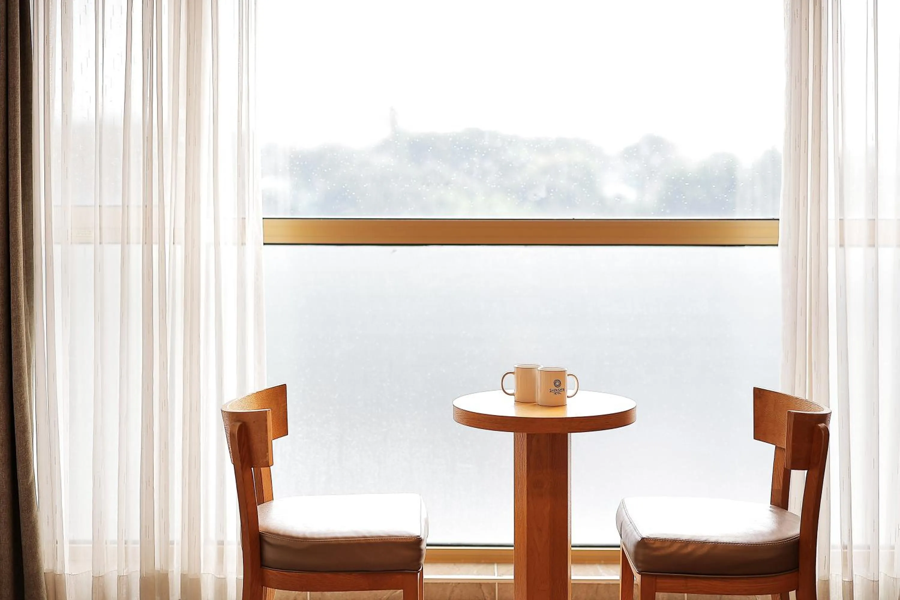 Seating area in Shin Shin Hotel Jeju City