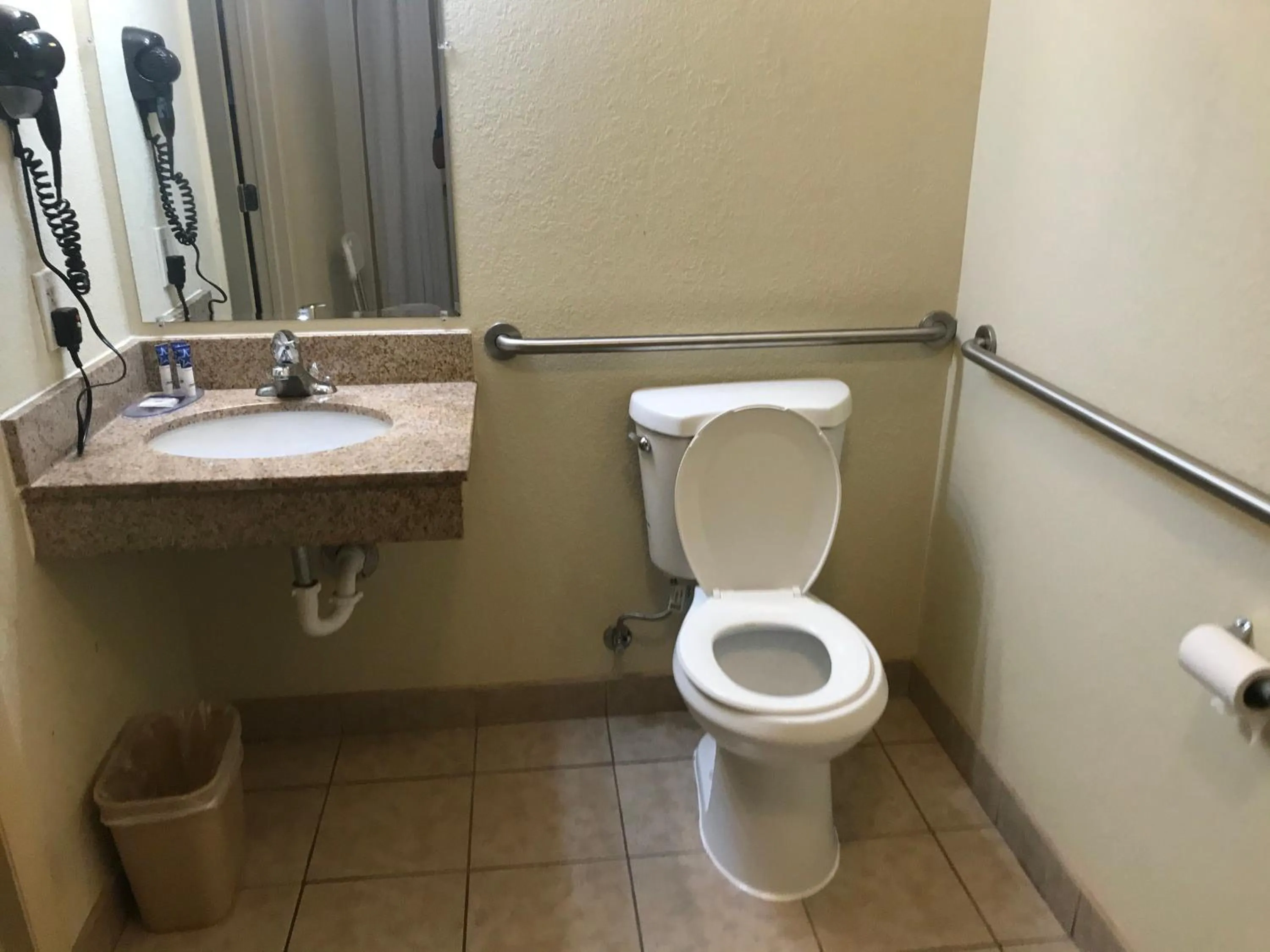 Toilet in Red Carpet Inn - Stamford