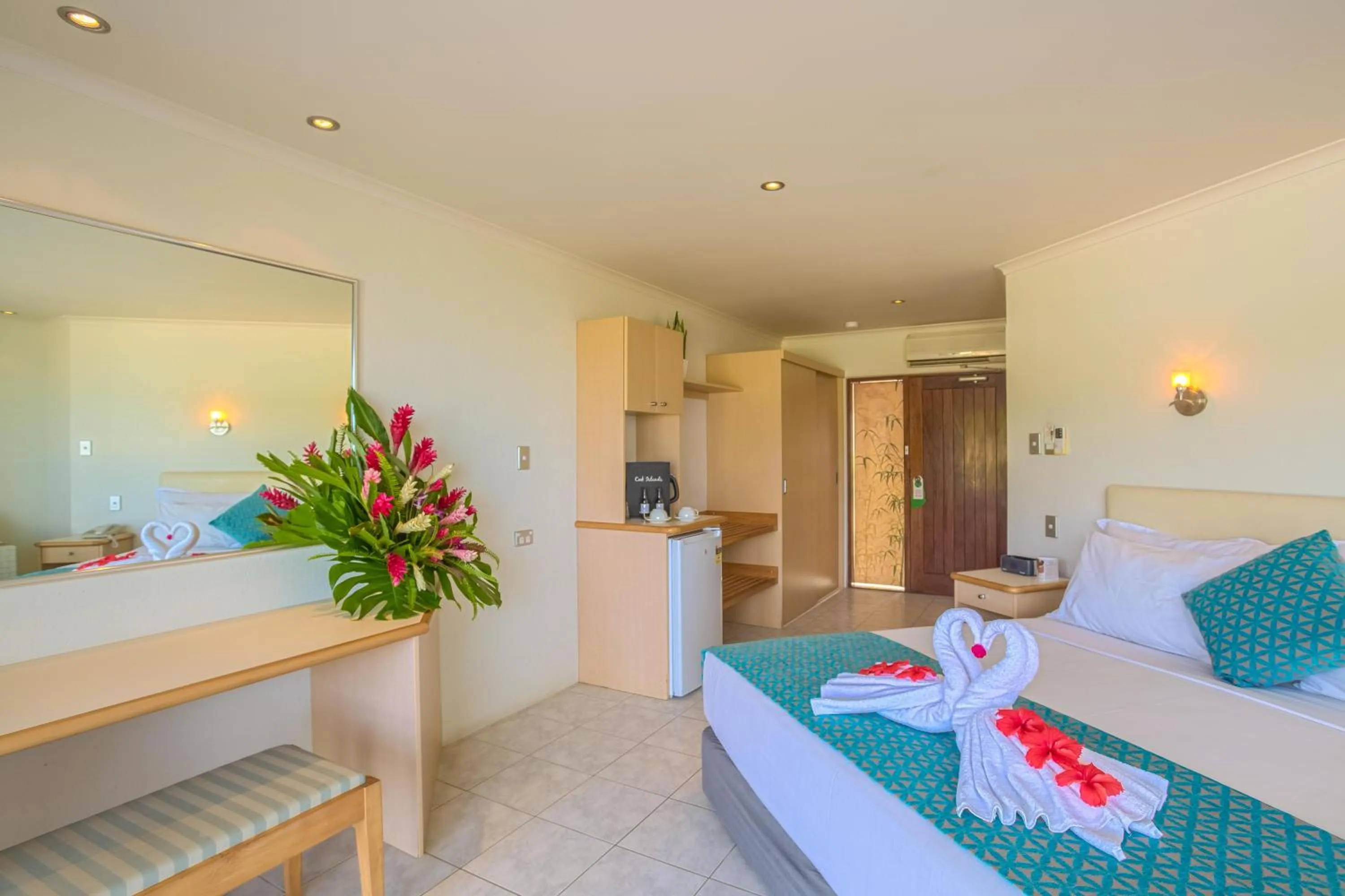 Patio, Bed in Muri Beach Club Hotel