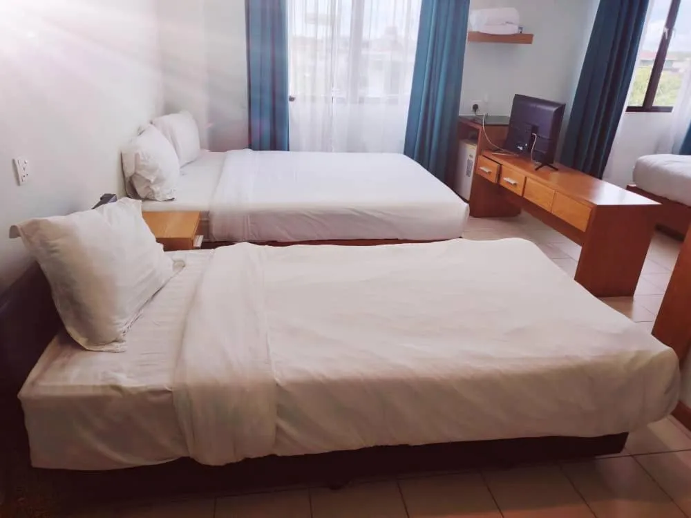 Bed in Fratini's Hotel Labuan