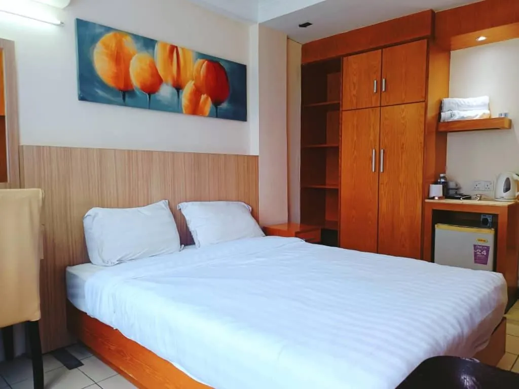 Bed in Fratini's Hotel Labuan