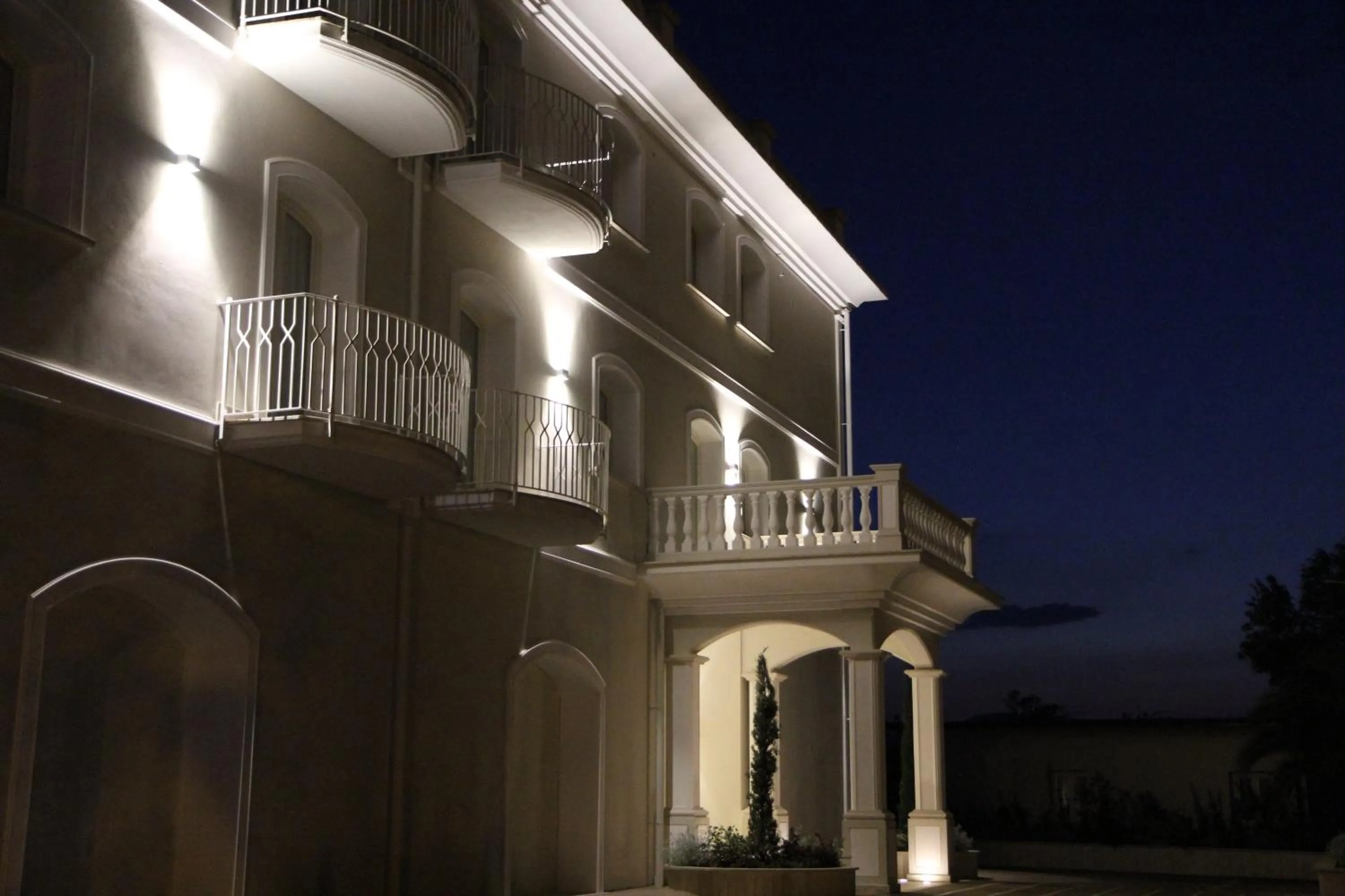 Property logo or sign in Suites & Apartments Liola'