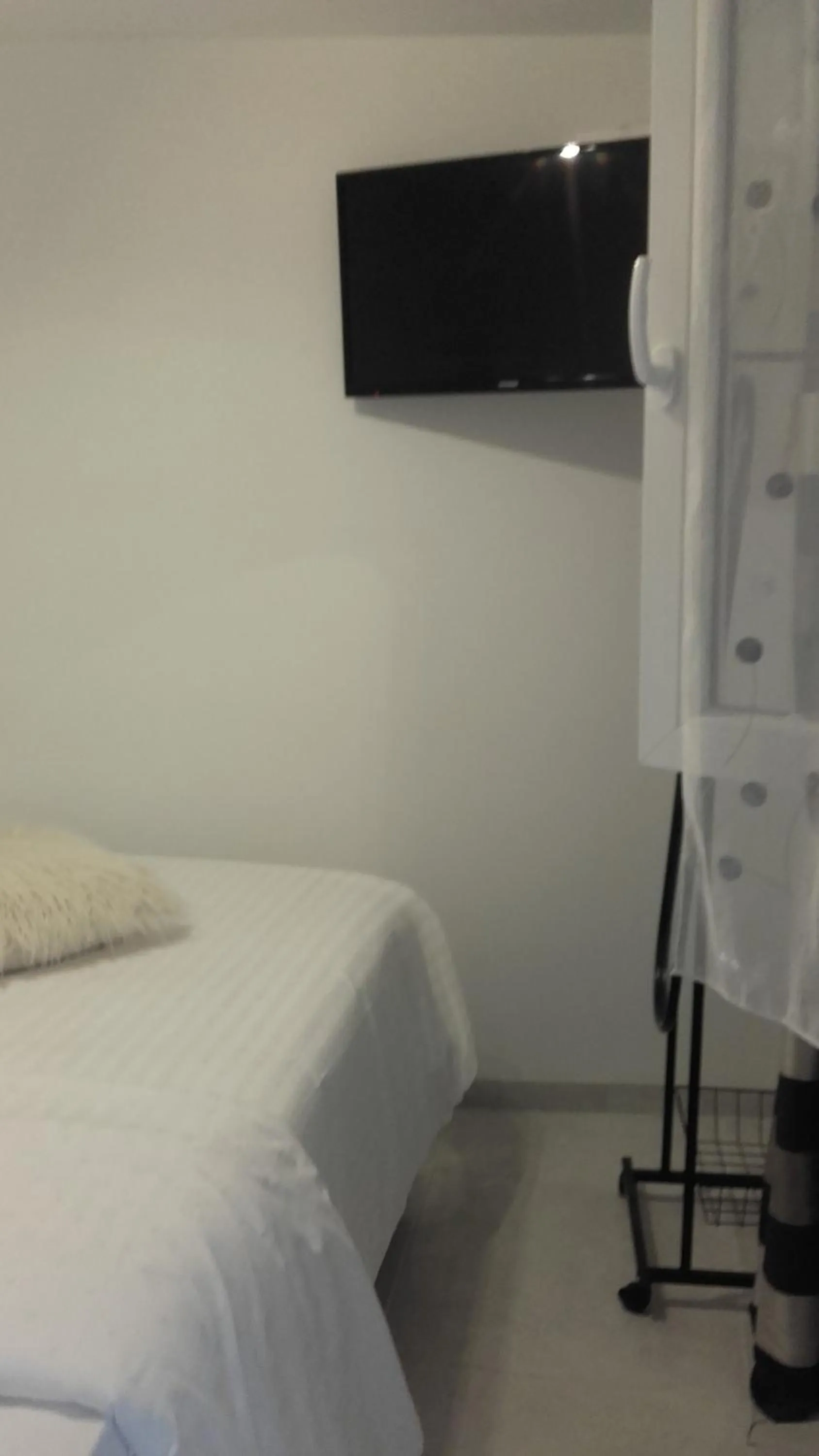 Bed in Chambres du Jardin Fleuri