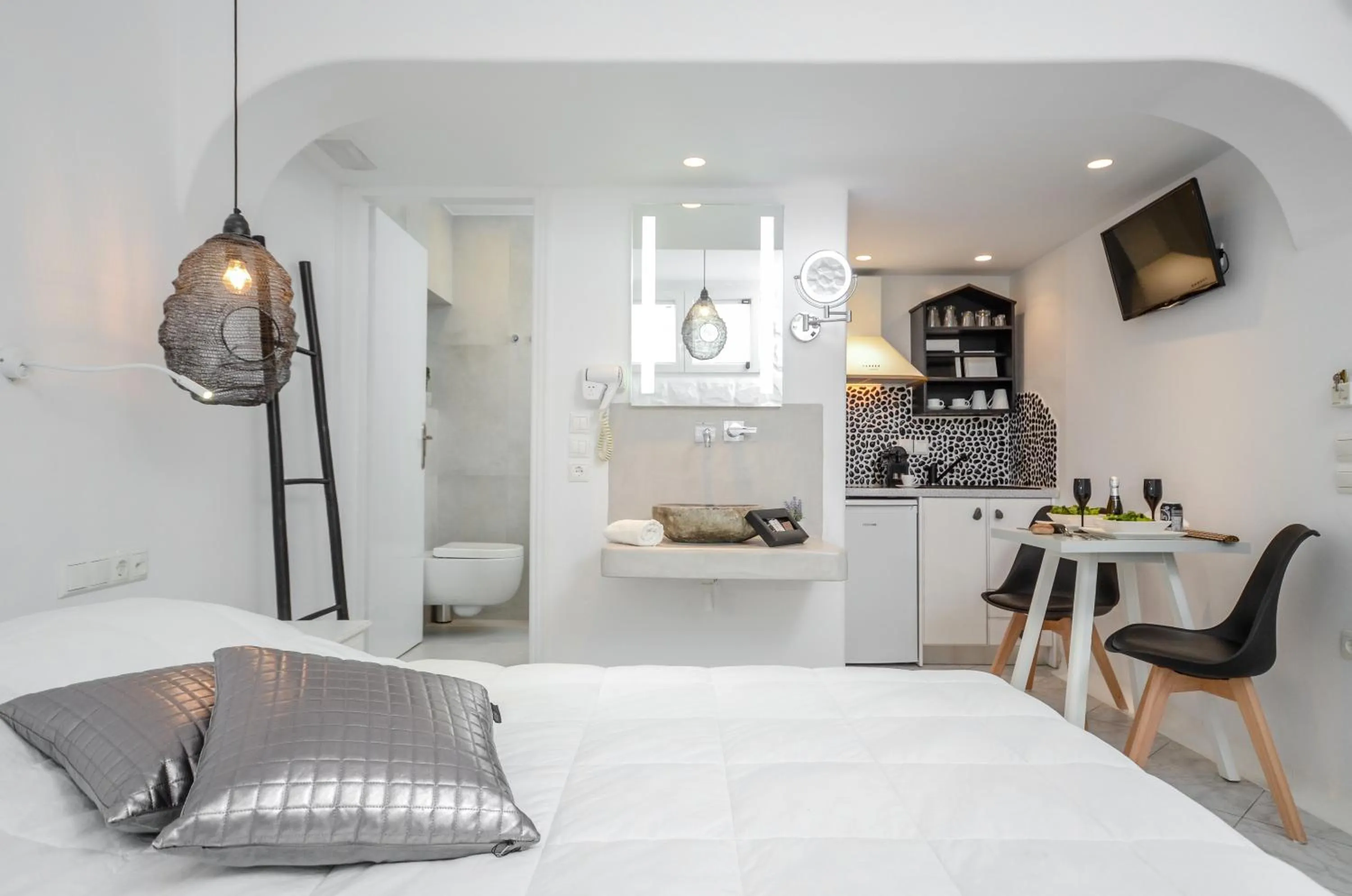 Bed in Naxos Evilion Luxury Apartments & Suites