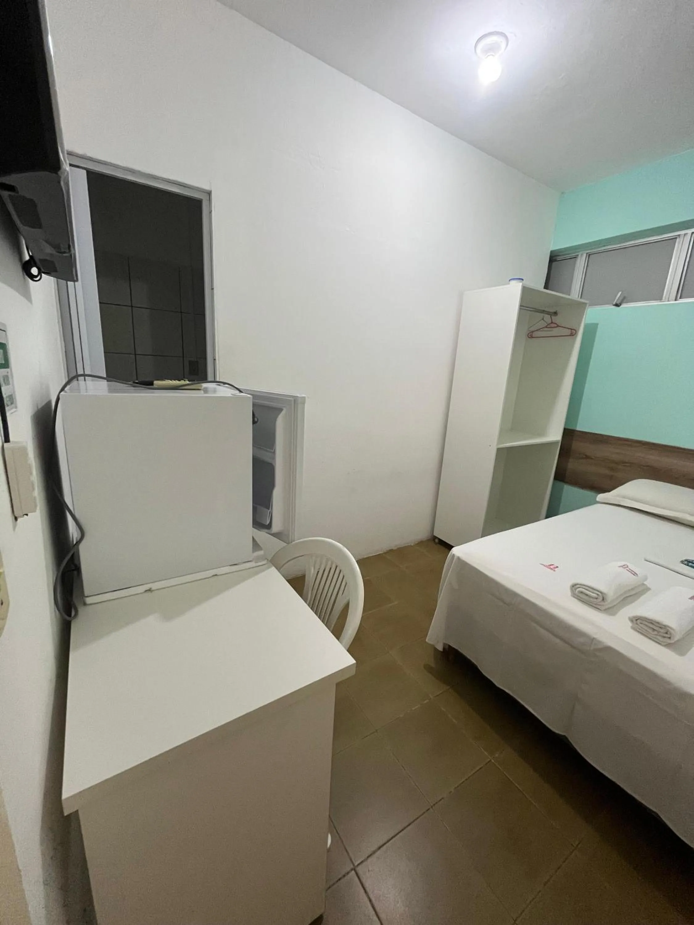 Bed in Pousada Executiva