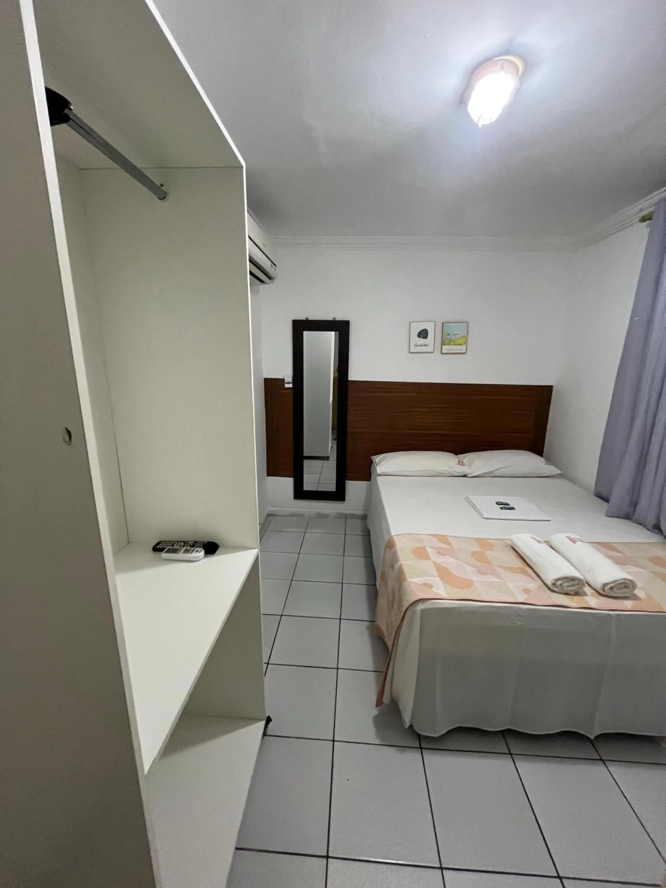 Bed in Pousada Executiva