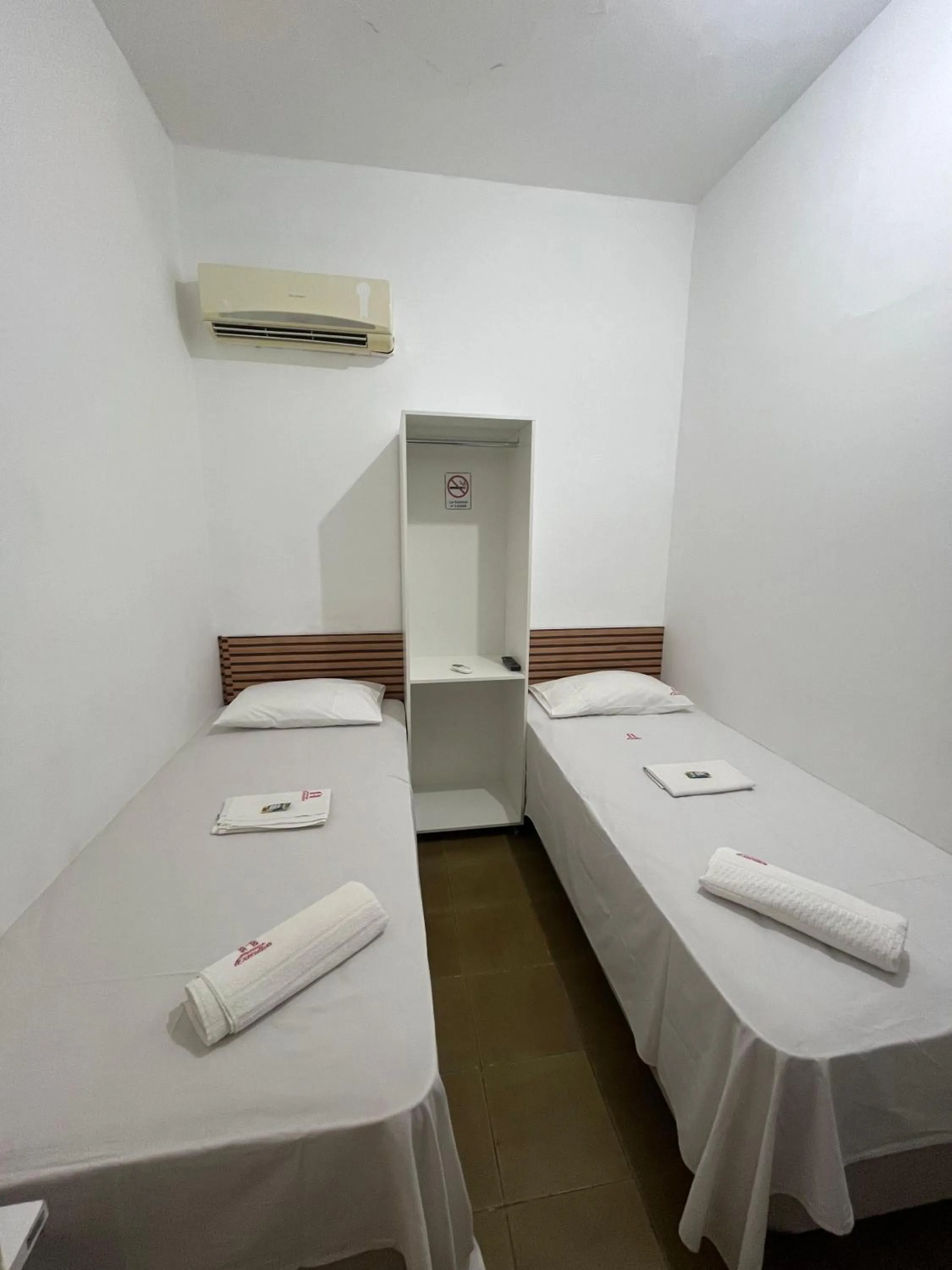 Bed in Pousada Executiva